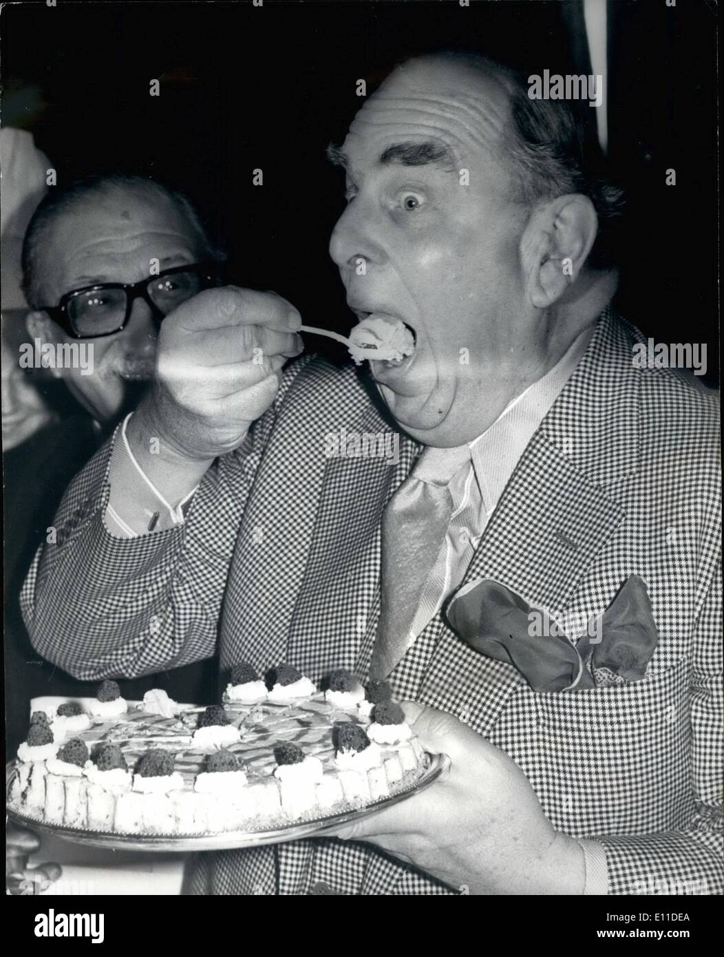 Mar. 03, 1977 - Robert Morley launches the taste of the English pudding: A vote of confidence in English cooking and the English pudding was intro ducted at the launch today by the English Tourist Board's 1977 Taste of England campaign. The launch was held at the Fishmongers' Hall in London, following a buffet lunch, took the form of a Great English Pudding tasting, a unique gastronomic occasion at which actor Robert Morley took the role of taster in chief. Photo shows actor Robert Morley seen tasting a pudding called 'Bliss' Stock Photo