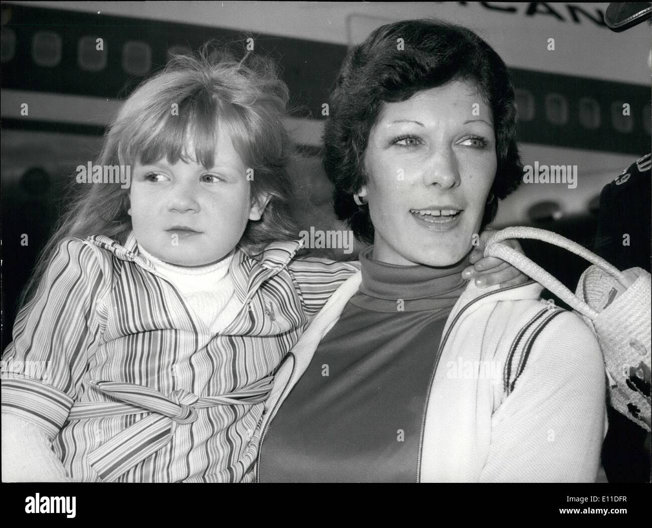 Aug. 08, 1977 - MOTHER OF HEART GIRL FINDS NEW LOVE IN SOUTH AFRICA: Mrs. Helen Pieri, 40, at Heathrow Airport with her daughter Katrina, aged 5, after arriving from South Africa where Dr. Christiaan Barnard had performed a heart operation on the child. The Pieris' trip was paid for by the people of Bletchley, who raised &pound;5,000 so Katrina could have the operation. Mrs. Pieri stayed at the Capetown home of her cousin Margaret and fell in love with her husband Desmond Holland-Muter Stock Photo
