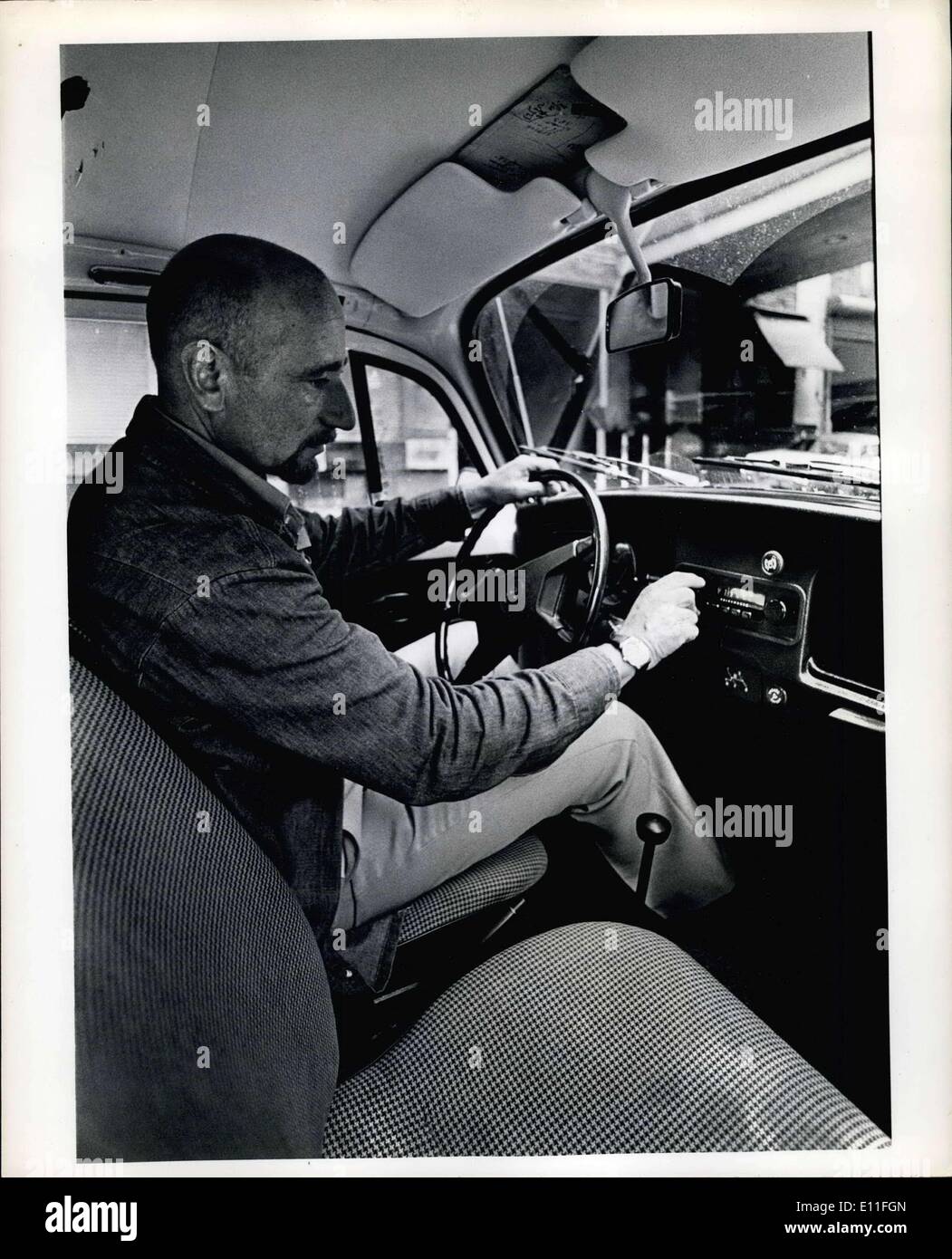 Jul. 12, 1977 - Man Turning Dial on Car Radio Stock Photo - Alamy