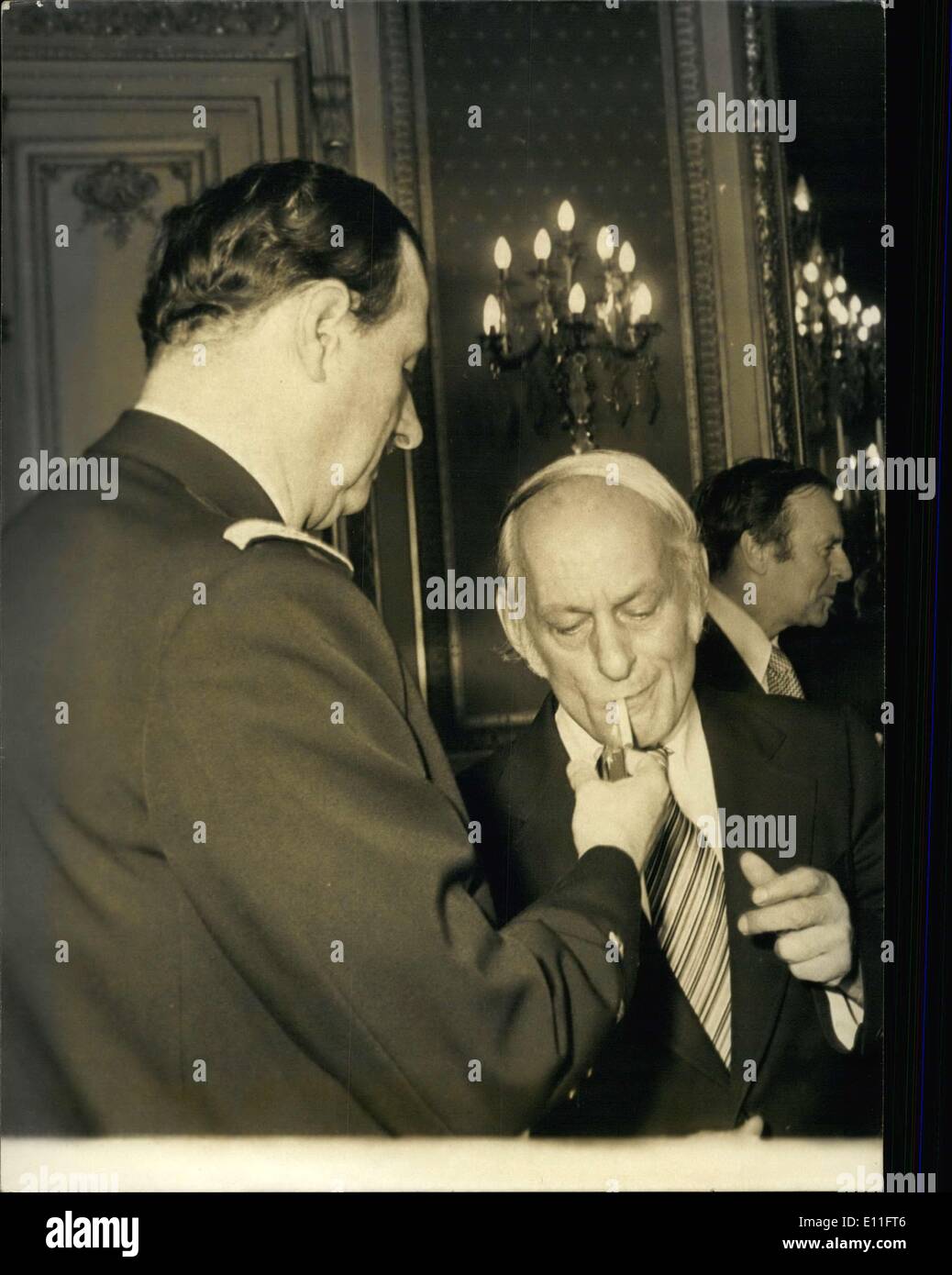 Nov. 03, 1977 - Admiral Philippe de Gaulle lights Rene Levesque's (the  Prime Minister of Canada) cigarette during a reception given last night in  honor of the former Minister of Justice Stock Photo