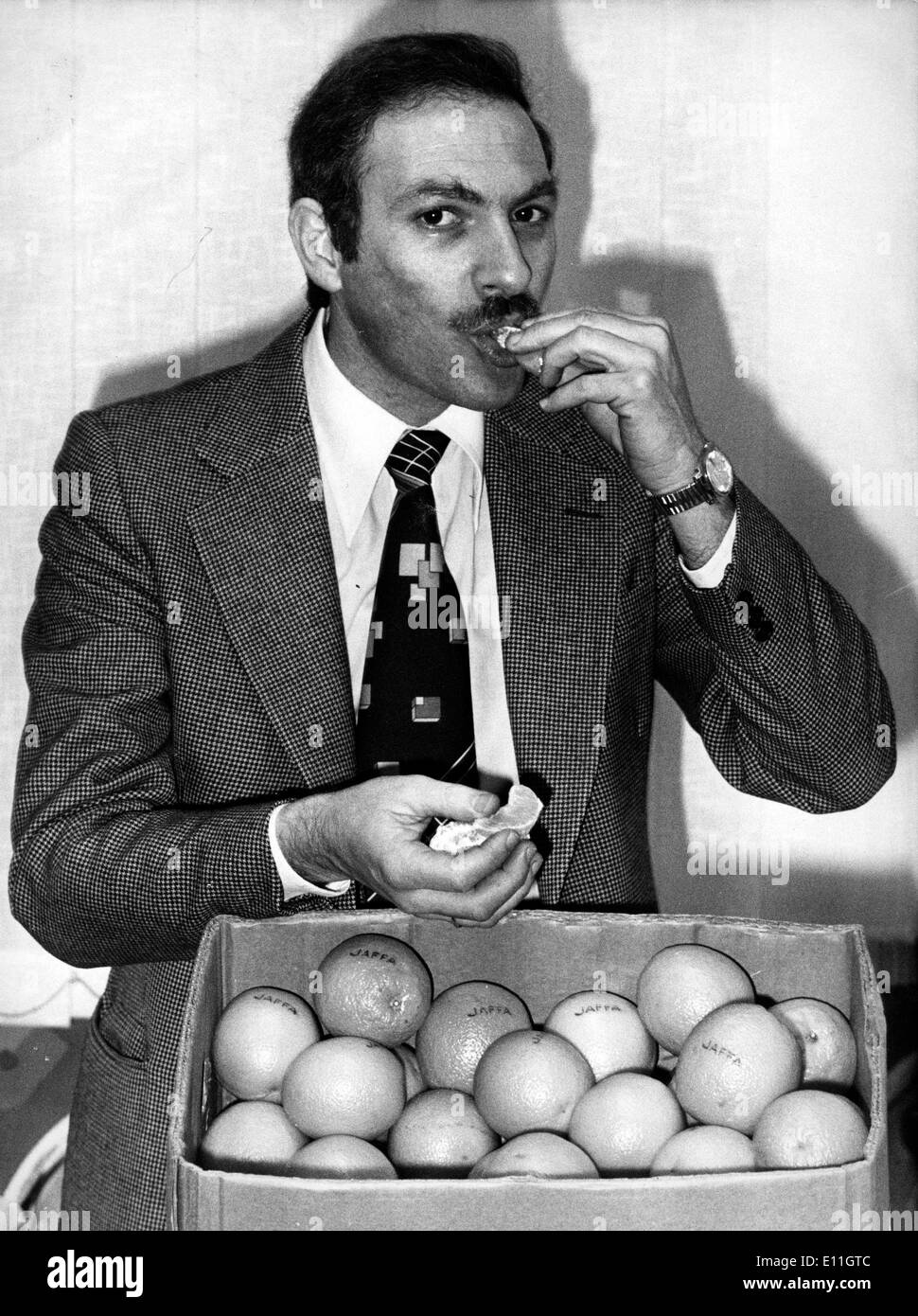 Feb 03, 1978; Paris, France; The oranges coming for Israel into Germany were presenting some mercure, France was adviced from this. The picture shows Mr. AMNON BARGER responsible for the foreign citrus marketing in France, trying an orange coming from Israel, for him was more about a pscychological war against the economy in Israel. Stock Photo
