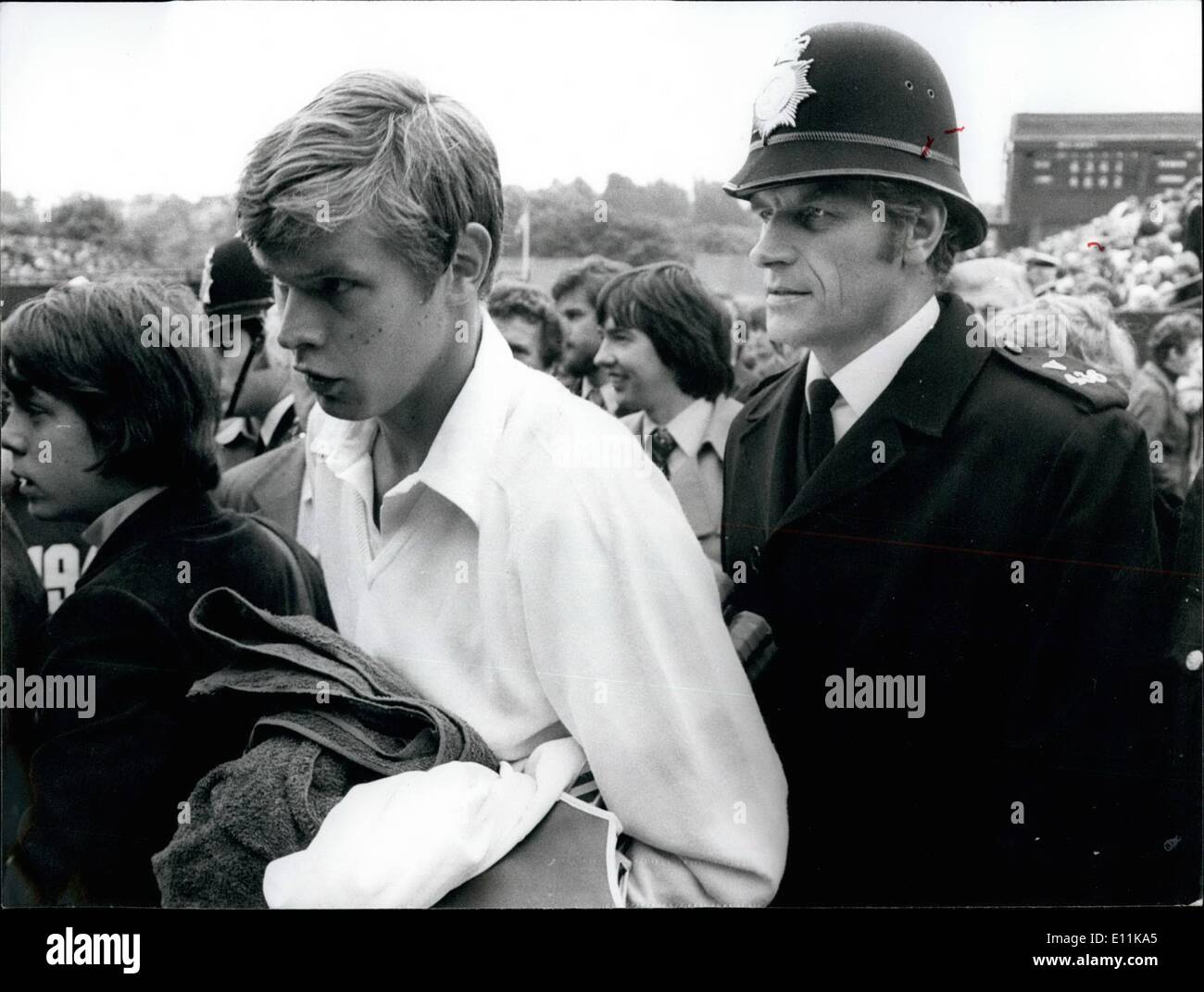 Jun. 06, 1978 - Wimbledon Tennis Championships Buster Mottrom Wins. Photo shows Buster Mottrom being escorted by a policeman as Stock Photo