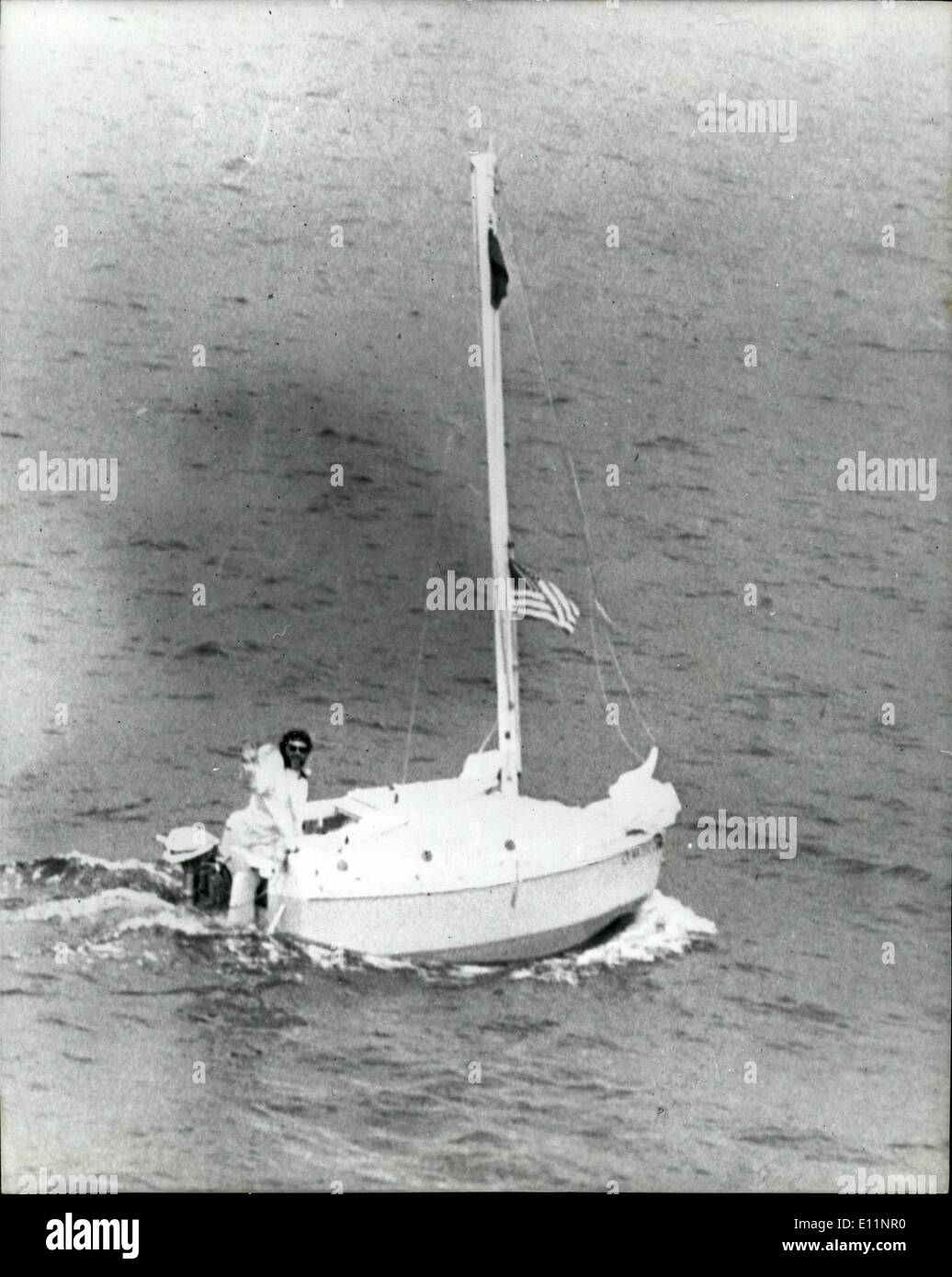 Jul. 07, 1979 - Bathclub' Sailor At Falmouth: Gerry Spiess, 39, sailed his home made 10 foot by five foot ''bathtub'' yacht into a great welcome at Falmouth, yesterday after crossing the Atlantic in 54-days. Hundreds watched as the blue Yankee Girl flying the stars and Stripes, and British came into harbour after its 3,200 mile voyage. Mr. Soiess who comes from Minnesota, was met by his 37-year-old wife Sally, and his parents. Photo Shows Gerry Spiess sailing his 10ft boat 'Yankee Girl' just before reaching Falmouth yesterday. Stock Photo