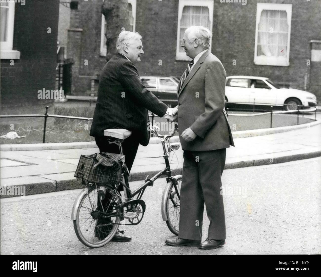 May 05, 1979 - Early Arrivals at No. 10 Downing Street. Mrs. Margaret Thatcher spent her day at No. 10 receiving a stream of Tory possibles for her cabinet. During the morning Lord Hailsham - a former Lord Chancellor - arrived on his bicycle and meet Mr. James Prior arriving on foot, and coatless in the Spring sunshine. Stock Photo