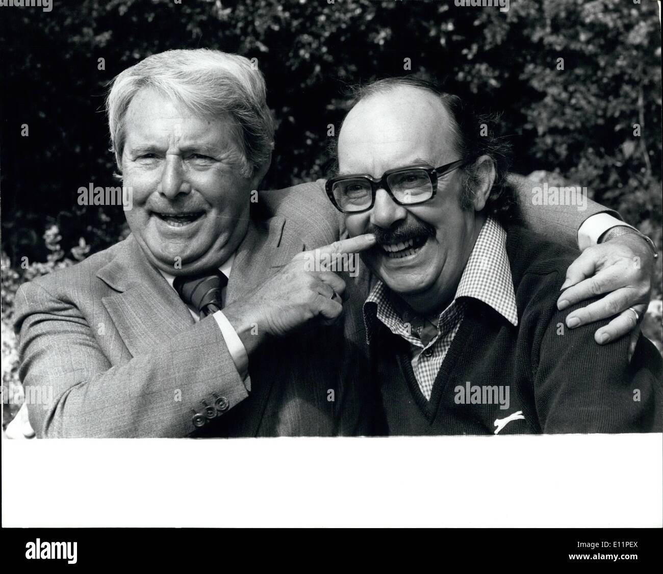Aug. 08, 1979 - ERIC AND ERNIE PLAN TELEVISOIN COMEBACK. ERIC MORECAMBE and ERNIE WISE renewed their comedy act yesterday and laughed off rumours that Eric's heart operation would stop them returning to television, at the home of Eric near Harpenden, Harts yesterday. photo shows: Morecambe and Wise show back in fine trim with a laugh at the expence of Eric Morecambe's moustache at the comedian's home at Harpenden, Herts, yesterday. Stock Photo