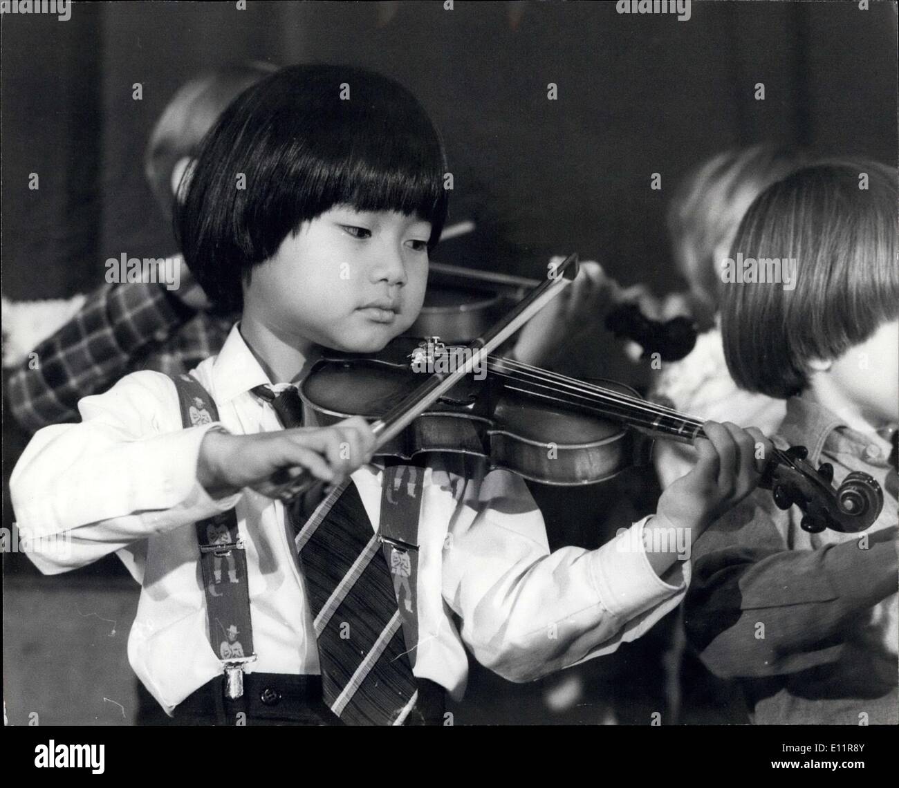 Dec. 17, 1979 - Infant Musicians Give a concert of classics Tetsuro Matsui,6, and Laurie Summers , 5, two of some 45 child musicians, some as young as two years, gave a public performances of Bach, Handel, Weber and Schumann over the weekend in Morley college, London. The children Learn by the methods of a Japanese teacher, Dr. shinichi Suzuki, based on the ancient Jesuit principle of imparting knowledge before a child reaches the age of seven. Stock Photo