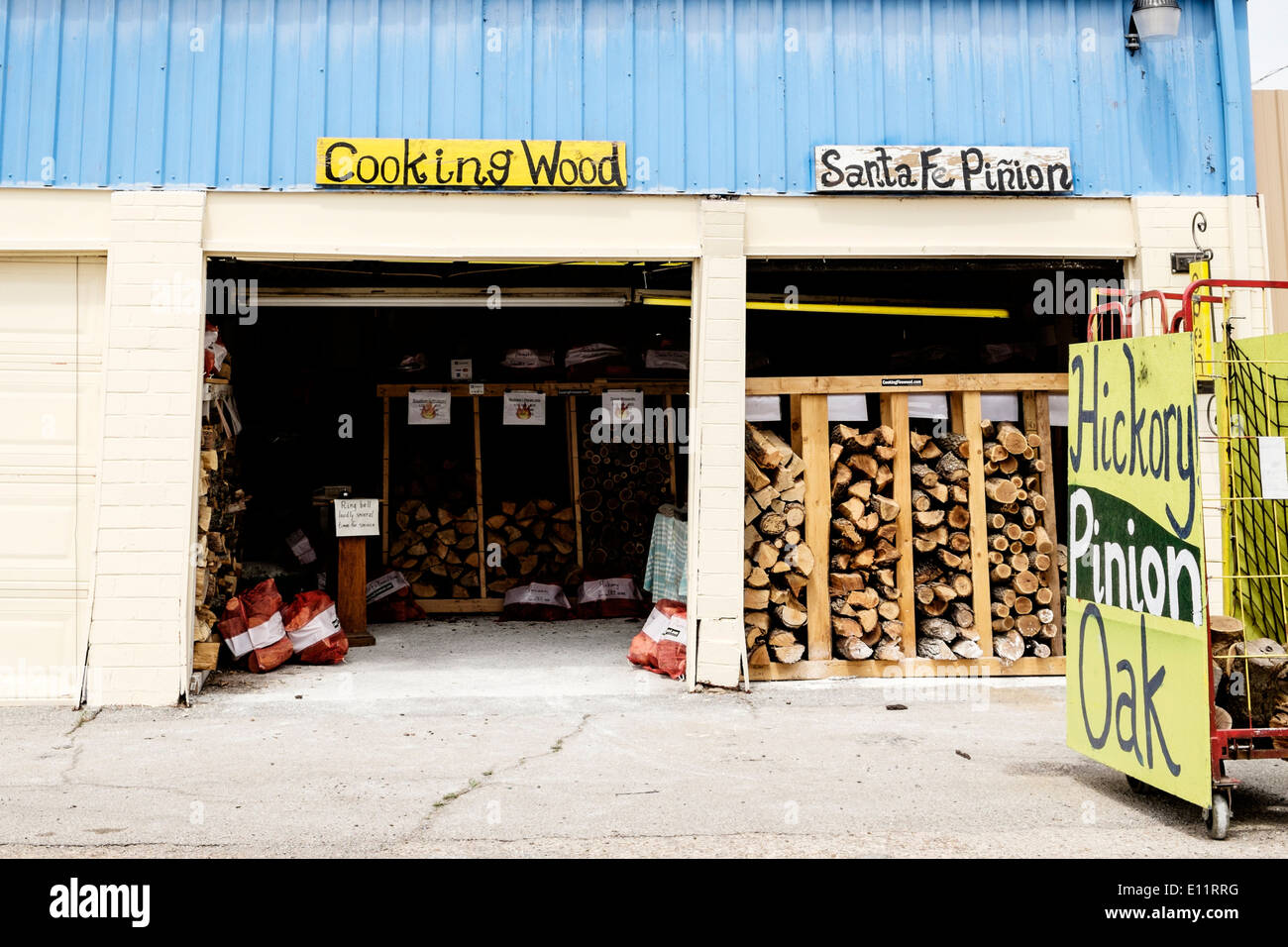 A business selling wood for meat smokers in a farmers market location in Oklahoma City, Oklahoma, USA. Stock Photo