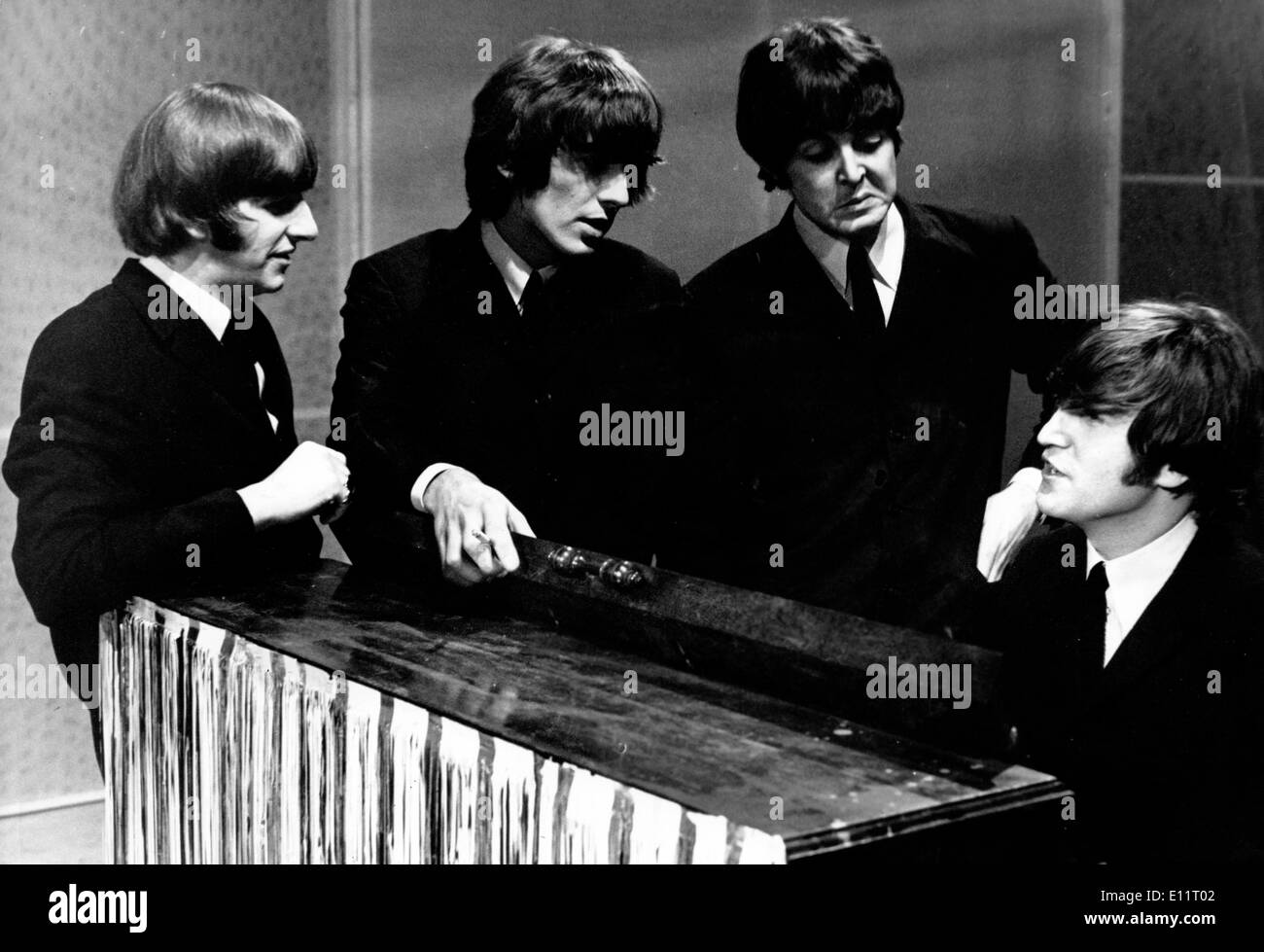 The Beatles RINGO STARR, GEORGE HARRISON, PAUL McCARTNEY, JOHN LENNON during recording session Stock Photo