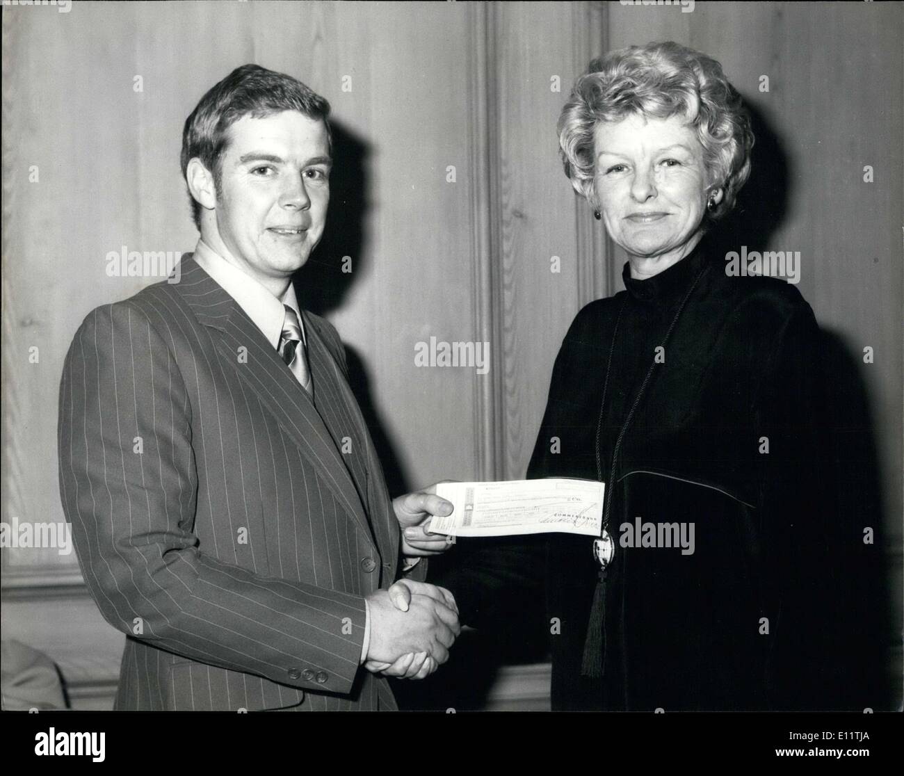 Nov. 22, 1979 - Cheque Presented For British Limbless Ex-service Men At The Savoy Hotel: Sgt. Lesslie Pasonso, club match of the Bumbe Water rats Angling club, West-Germany, (S Club of British Servicemen,m their dependents, and attached UK citizens). presenting a cheque for ?1,034 for the benefit of the British Laimbless Ex-Service men's Association (BLESMA) to Elaine Stretch, the, the American actress, at the Savoy Hotel last night. The cheque represents the proceeds of the Marathon sponsored Fish. Stock Photo