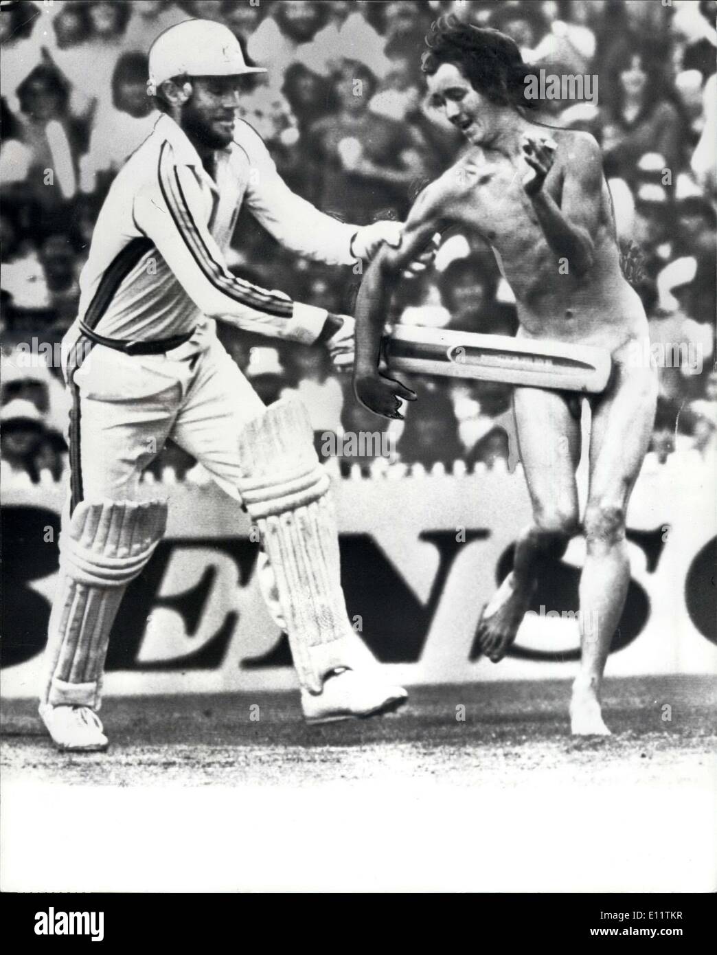 Dec. 10, 1979 - Streaker Invades world series pitch: A streaker interrupted play during the world Series match in Brisbane between Australia and West Indies. Photo Shows Australian Captain Greg Chappell covers up the Vital part of the streaker with his bat. Stock Photo