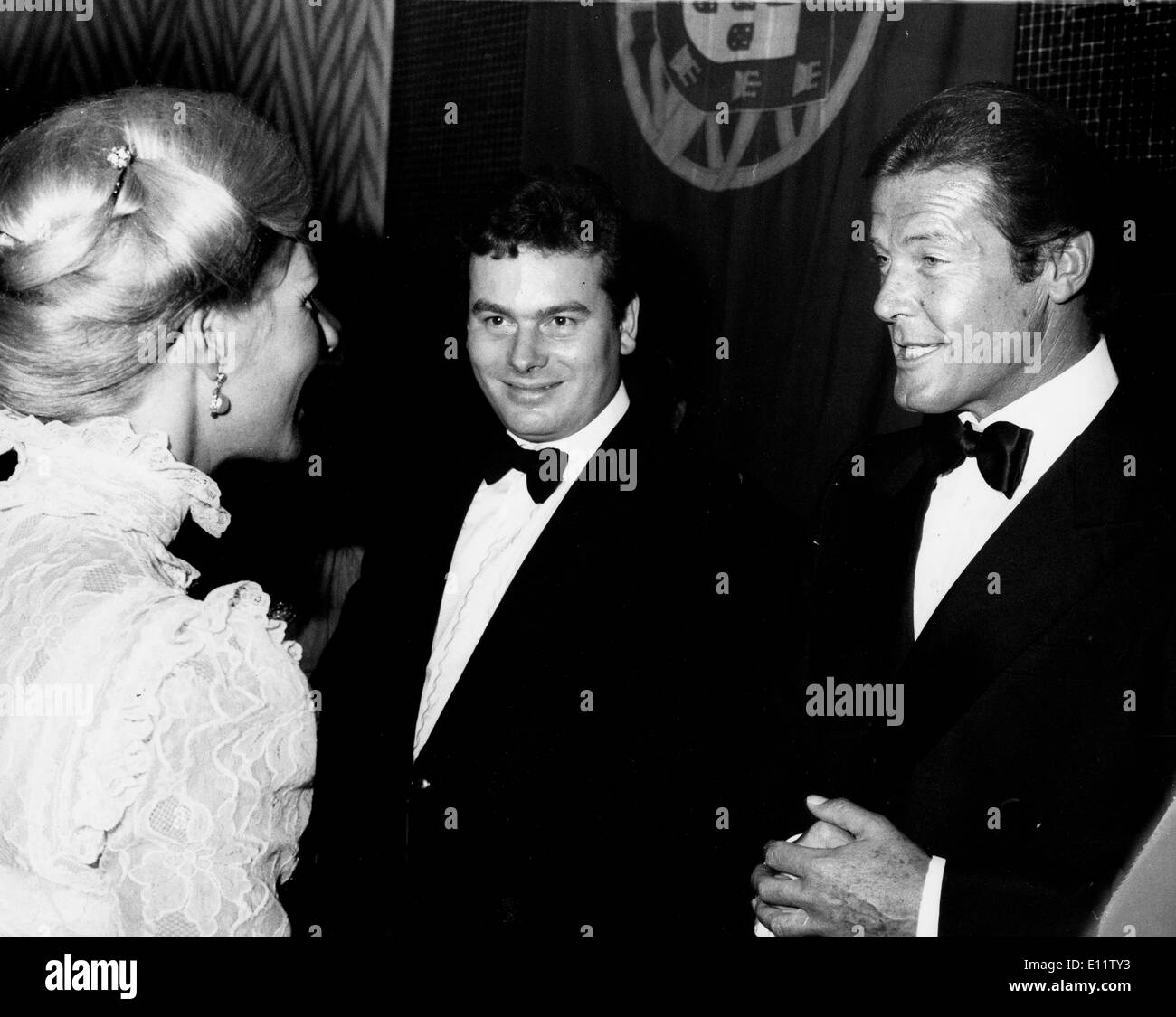 Actor Roger Moore chats with Katharine, Duchess of Kent Stock Photo
