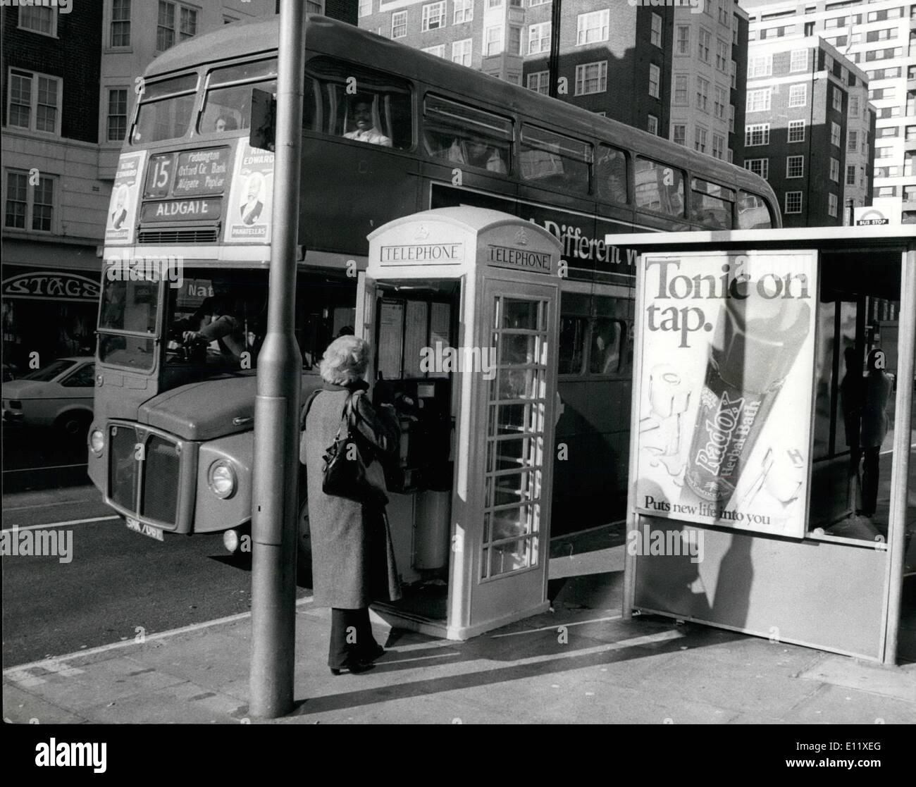 Feb. 02, 1981 - PHONE BOXES GO YELLOW: Ever since the early 1930's phone boxes throughout Britain have been red-but now as an experiment they are painting them yellow, and their 77,000 in all. This new color scheme has been thought up by Telecom, and will cost a minimum of &pound;1 million to paint all these telephone boxes. PHOTO SHOWS A london Red Bus seen passing a newly painted bright yellow telephone box. Stock Photo