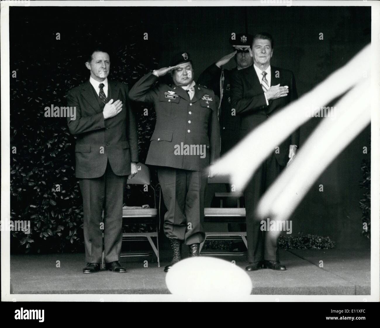 Feb. 02, 1981 - Hero Salutes with the president ; Shown saluting after the congressional medal of honor ceremony at the pentagon today are ; left to right secretary of Defense Caspar Weinberg. medal winner Sgt. Roy P. Benavidez of E1 compo, Texas and president Ronald w. Reagan. Stock Photo