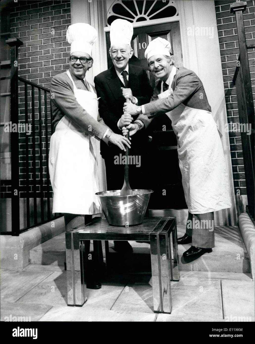 Nov. 11, 1980 - ERIC AND ERNIE'S CHRISTMAS SHOW Sir Alec Guinness is Eric and Ernie's principal guest on this year's Christmas Show now being shot at Thames Television's Teddington Studios. PHOTO SHOWS Eric Morecombe and Ernie Wise seen outside a mock-up of No 10 and with the help of Sir Alec Guinness they are seen stirring a christmas pudding. Stock Photo