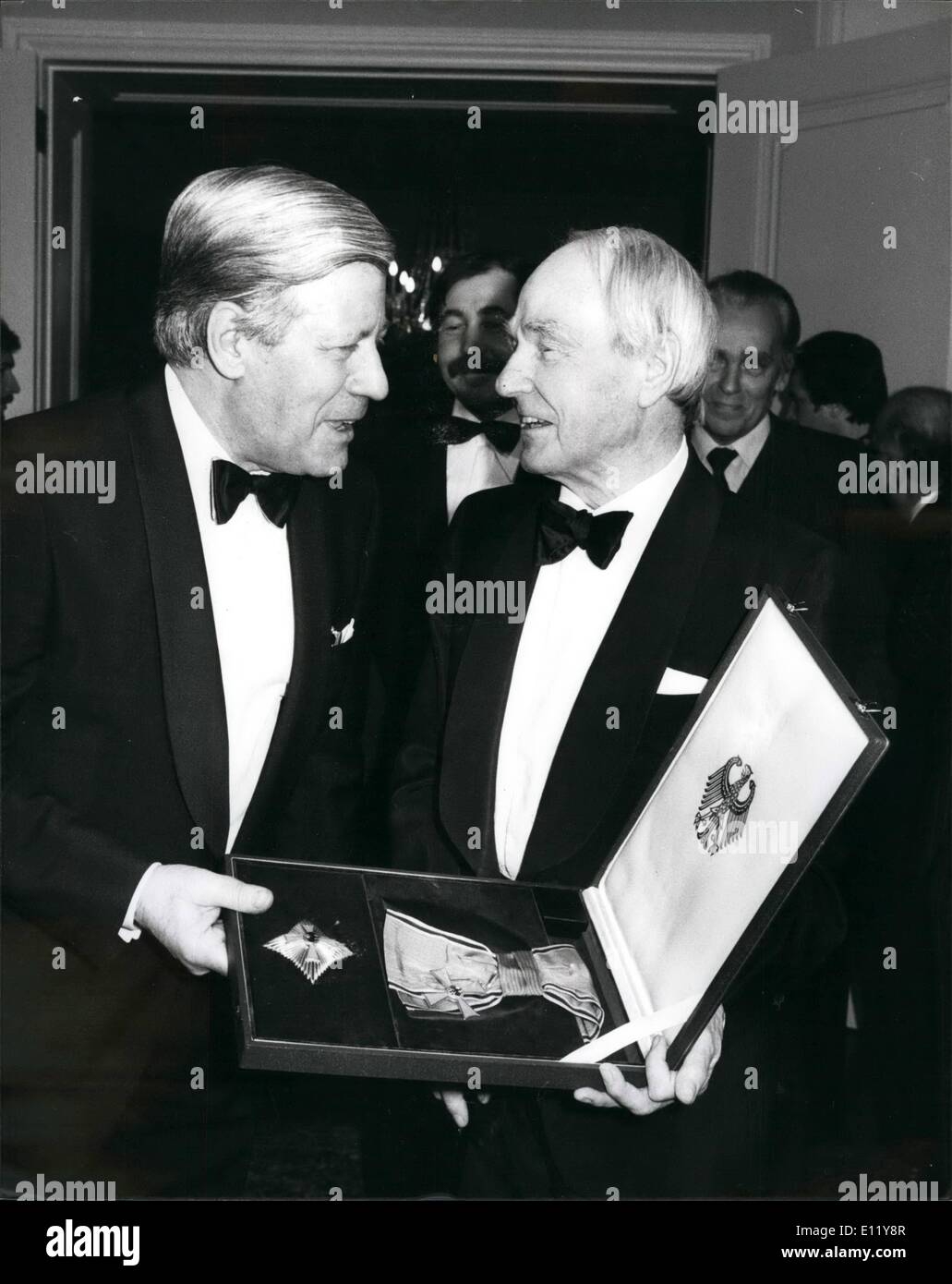 Dec. 12, 1980 - Germans Honour Henry Moore: Sculptor Henry Moore, 82, received the Grand Cross of the Order of Merit of the Federal Republic of Germany at a ceremony in the in the Embassy in Belgrave Square, London last night. Helmet Schmidt, the West German Chancellor presented it to him. He has becomes one of the world's most renowned sculptors, and his work is on show in very continent. A number of his major works are in West Germany, where he is regarded as a ''popular'' artist in the best sense Stock Photo