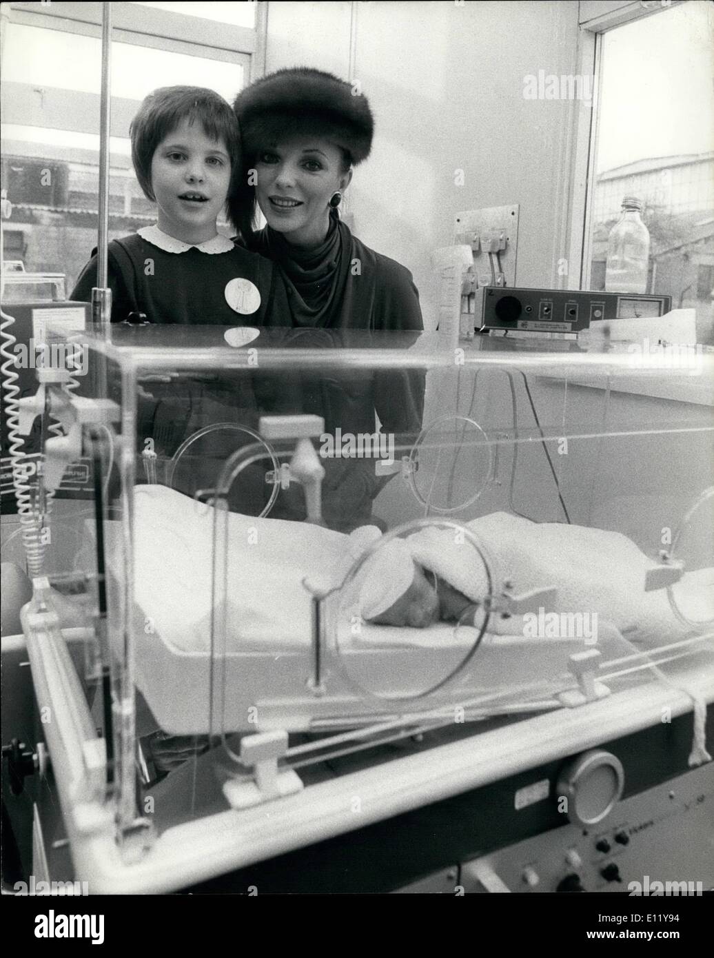 Dec. 12, 1980 - Joan Collins' Smile Says Thankyou The gratitude showed on actress Joan Collin's face when she went back with her daughter Katyana to the hospital where doctors saved her young life after a road accident. Back in the summer 8 year old Katy spent 42 days in a coma at the Central Middlesex Hospital in London. On Friday the 46 year old star went back to the hospital to present the hospital with ,000 worth of baby care equipment, including an incubator. the money for the equipment was collected by the charity Bilss. Stock Photo