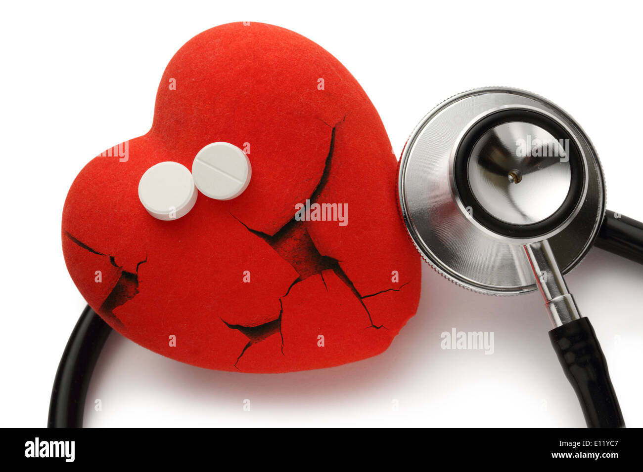 Red broken heart, stethoscope and pills on white Stock Photo Alamy