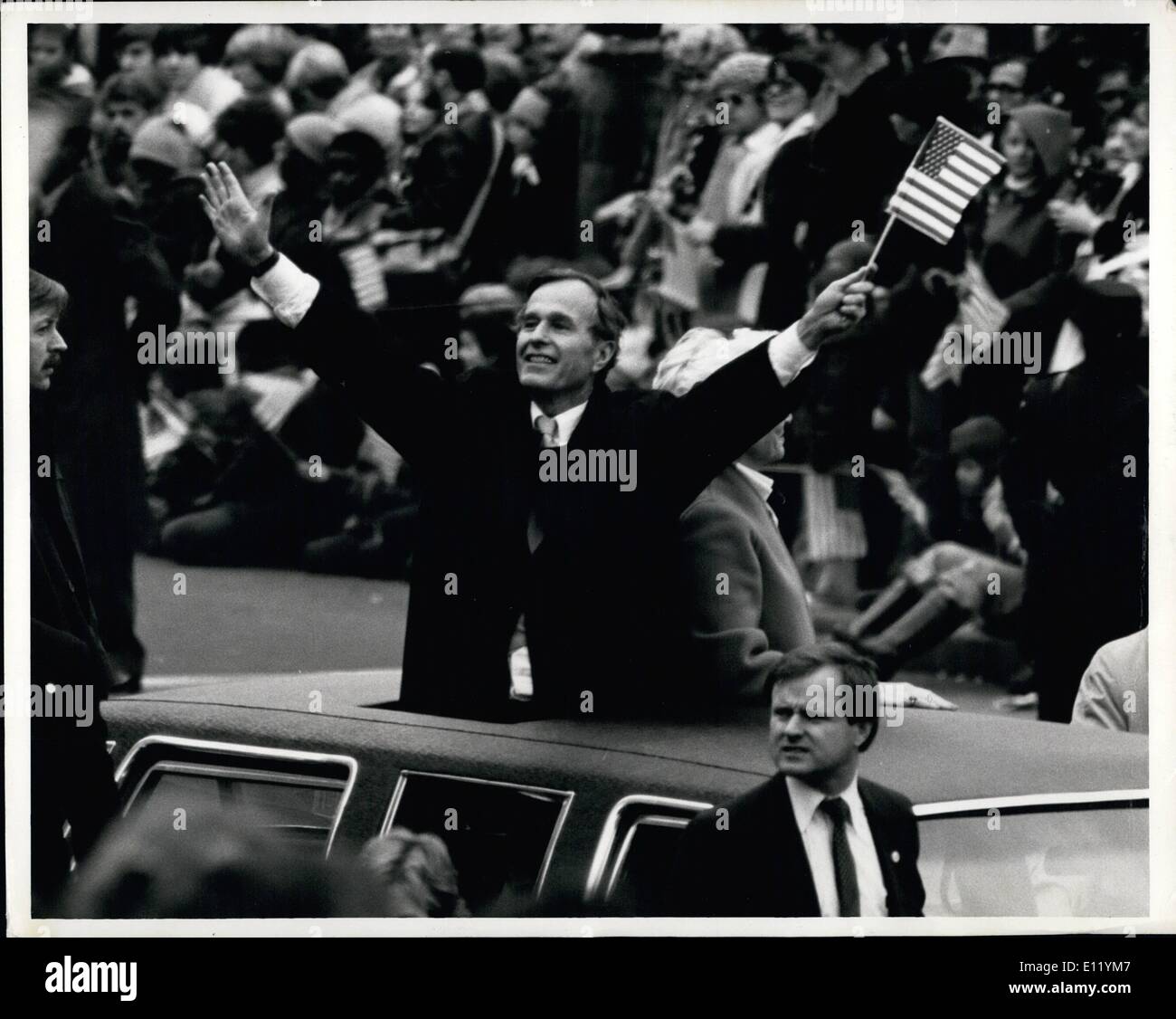 Jan. 01, 1981 - Vice President George Bush waves an American flag as he rides along the parade route today after he was sworn in with Ronald Reagen. Stock Photo