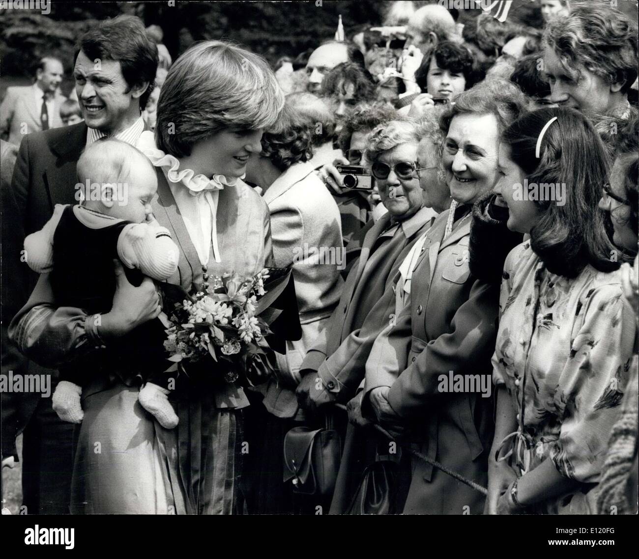 May 09, 1981 - Prince Charles and Lady Diana open broadlands Exhibition: Today Prince Charles and Lady Diana Spencer, officially opened the Mountbatten Exhibition at Broadlands, Ronsey, Hampshire. the exhibition has been created by Lord and LAdy Ronsey, as a tribute to Lord and Lady Mountbatten. Photo shows Lady Diana seen hold the three month old baby of a Mrs Phillips, fast right who handed it her during her walk in the ground with Prince Charles at Broadlands today. Stock Photo
