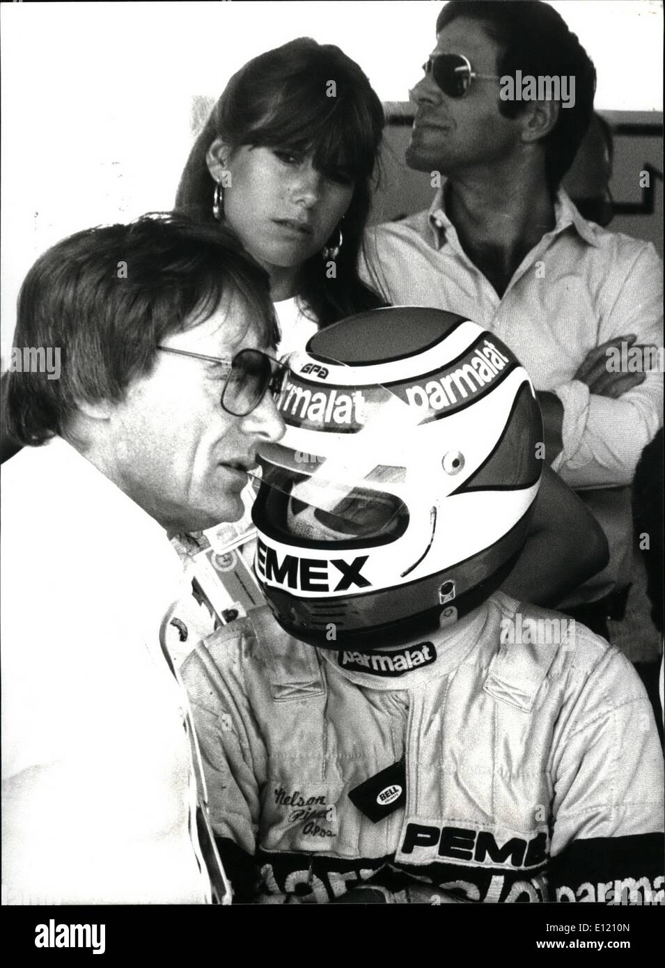 Sep. 09, 1981 - Brazilian formula-one driver Nelson Piquet (with helmet), team-boss Bernie Ecclestone (left) and Piquet's girlfriend Silvia from Holland (background). Keystone Zurich 09-24-81 Stock Photo