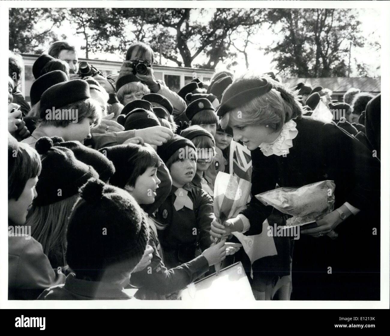 Oct. 06, 1981 - Princess of Wales Charms the children of Builth Wells: As part of her tour of the principality with her husband, the Princess of Wales yesterday met hundreds of children at the Royal showground at Builth walle. In contrast to the previous rainswept days of the tour the sun shone brightly as the Prince, dressed in a euit of burgundy velvet with a matching ostrich - feather trimmed hat, stopped to chat to her young admirers including many cubs and Guides. The former Kindergarten teacher shock hands with and accepted shy kisses from some of her young well - wishers Stock Photo