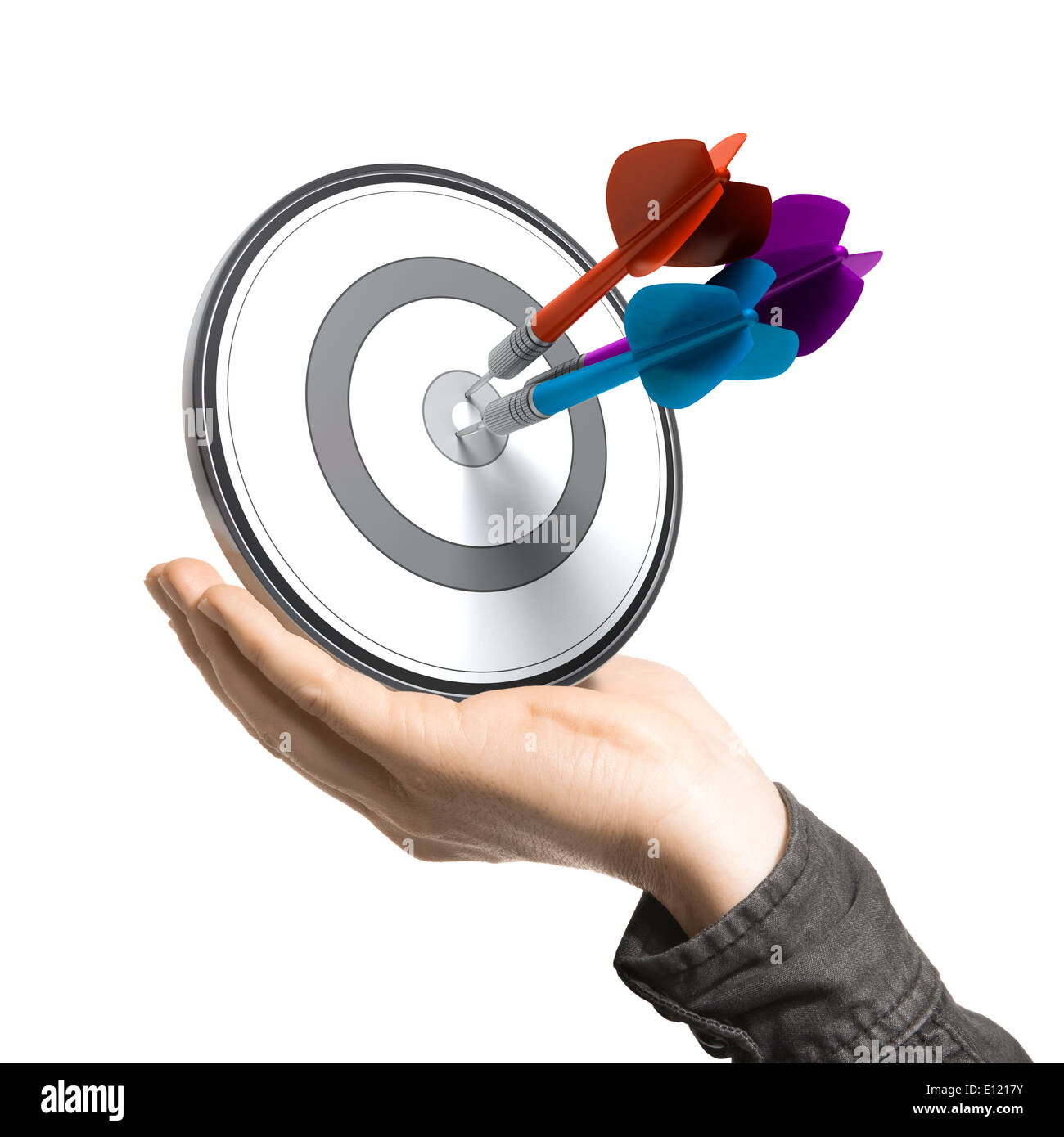 One hand holding a target with three darts hitting the center, white background. Stock Photo