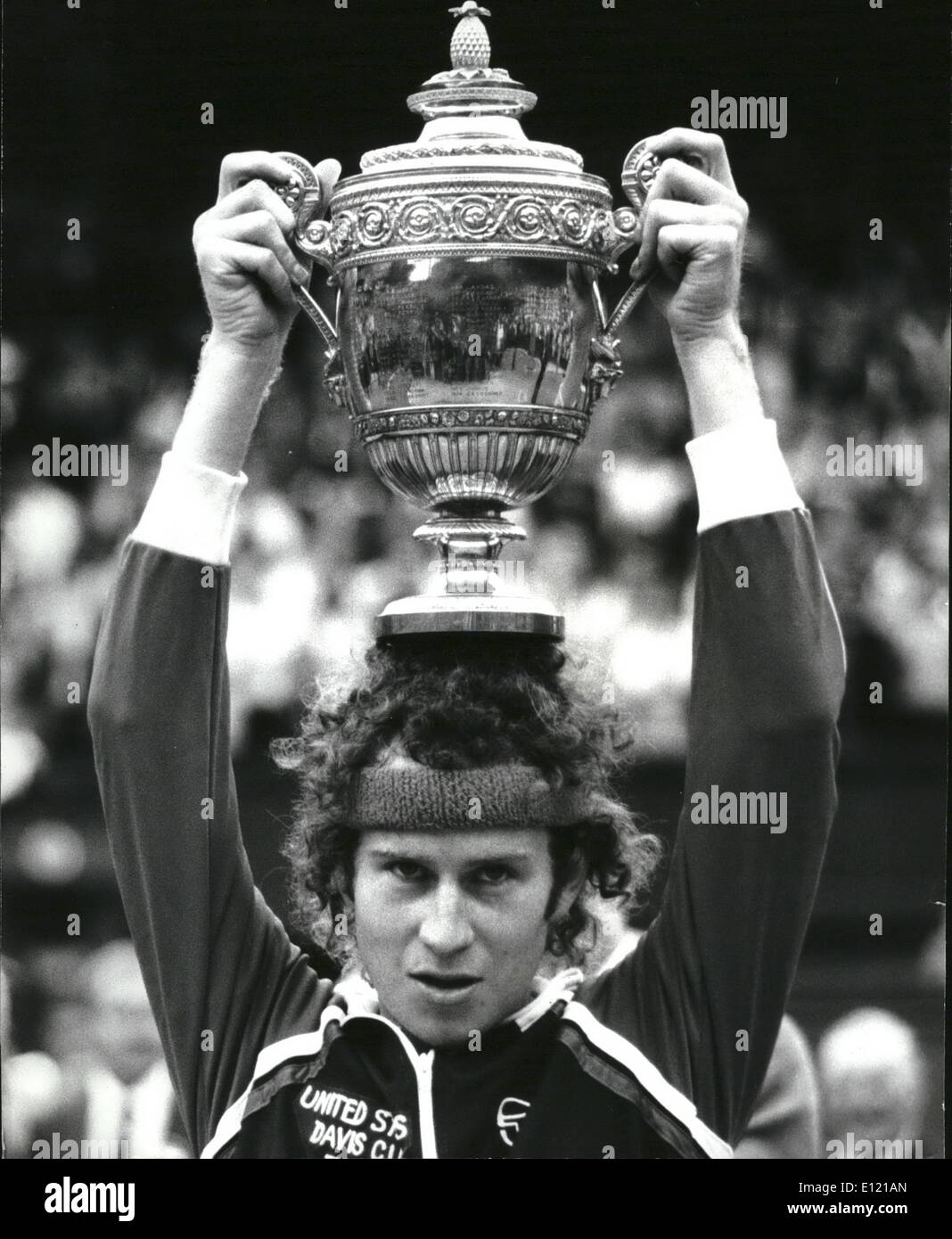 Jul. 05, 1981 - July 5th 1981 McEnroe wins the Wimbledon Title. American John McEnroe became the Wimbledon champion on Saturday when he beat the holder of the title for the last five years, Bjorn Borg. 6-4, 6-7, 6-7, 4-6. Photo Shows: John McEnroe holds up the trophy after beating the holder Bjorn Borg n the men's singles final on the centre court at Wimbledon. Stock Photo