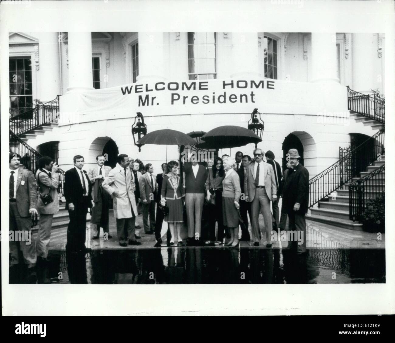 Nov. 11, 1981 - Consolidated news pictures : Reagan arrives at white house. Washington President and Mrs. Ronald Reagan arrive at the white house from Georgetown hospital where the chief executive was recuperating from his gunshot would as he was leavening a Washington, D.c. hotel. Also shows under the ''welcome Home Mr. President'' sign is Vice president and Mrs. George Bush. white house photo from consolidated. Stock Photo