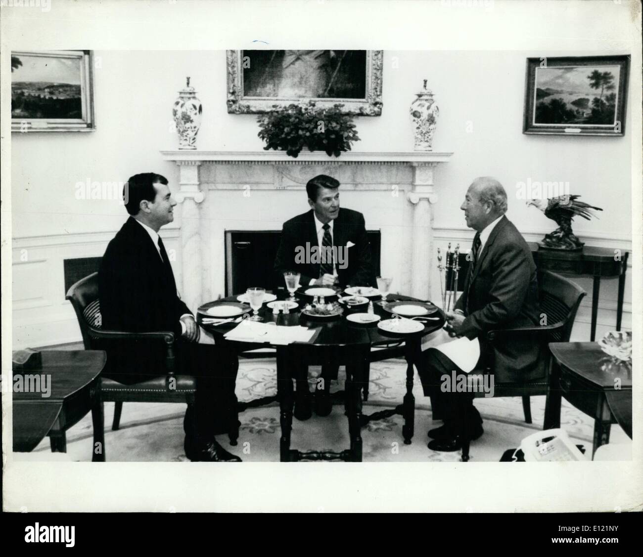 Sep. 09, 1982 - Solving The World's Problems: President Ronald Reagan is shown as he met with his Secretary of State, George Shultz and his National Security Advisor, William Clark during a luncheon meeting in the Oval office of the White House. Stock Photo