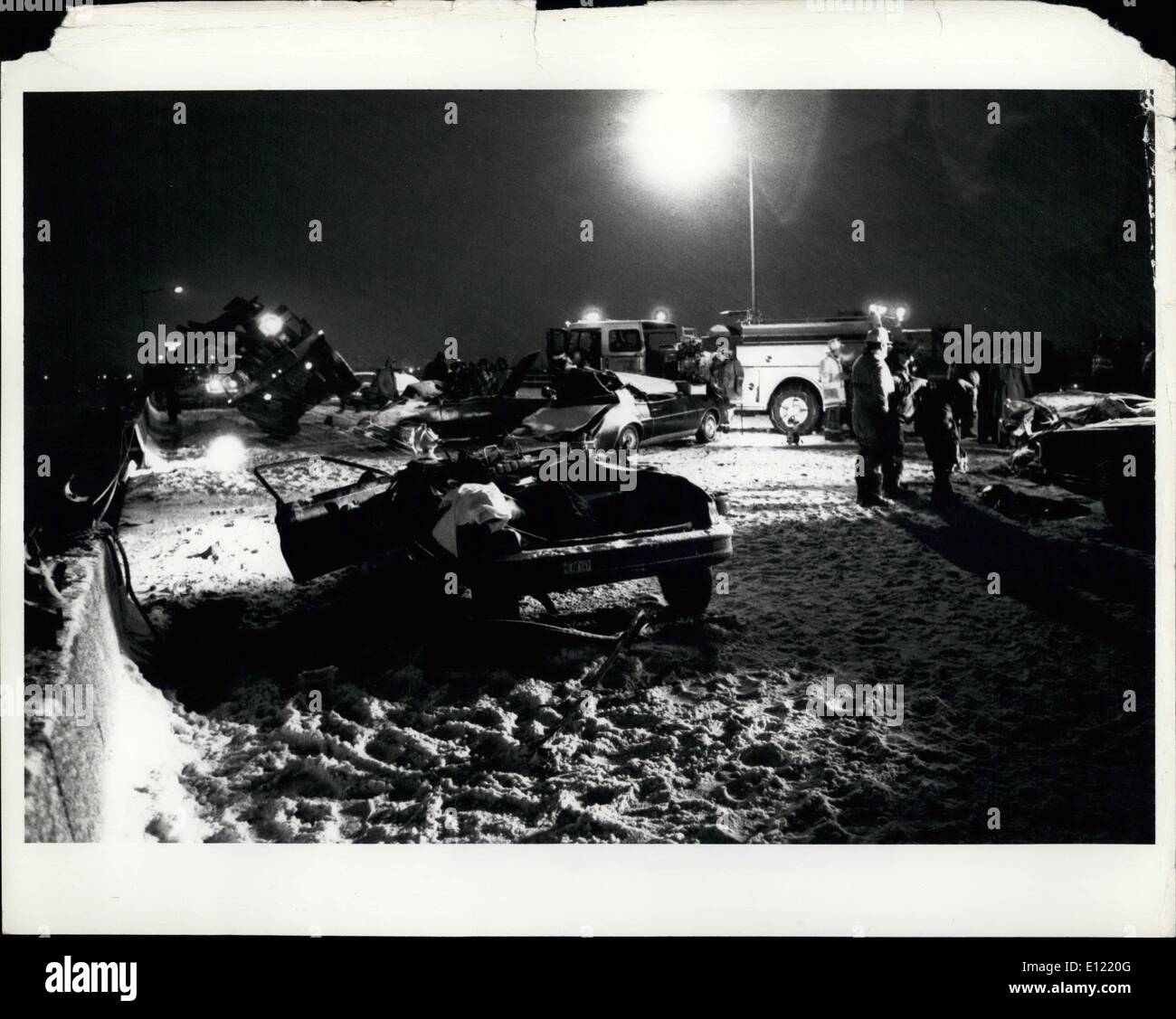 Jan. 01, 1982 - Damaged Cars and Bridge: Cars with their roofs crushed or completely torn off are strewn on the 14th street bridge after being hit by a Florida 727 jet crashed on takeoff .The Plane just left National Airport. The plane struck the cars on the bridge during rush hour traffic and then crashed in the river and quickly sunk. Most of the passengers are still trapped in the plane presumed dead. Stock Photo