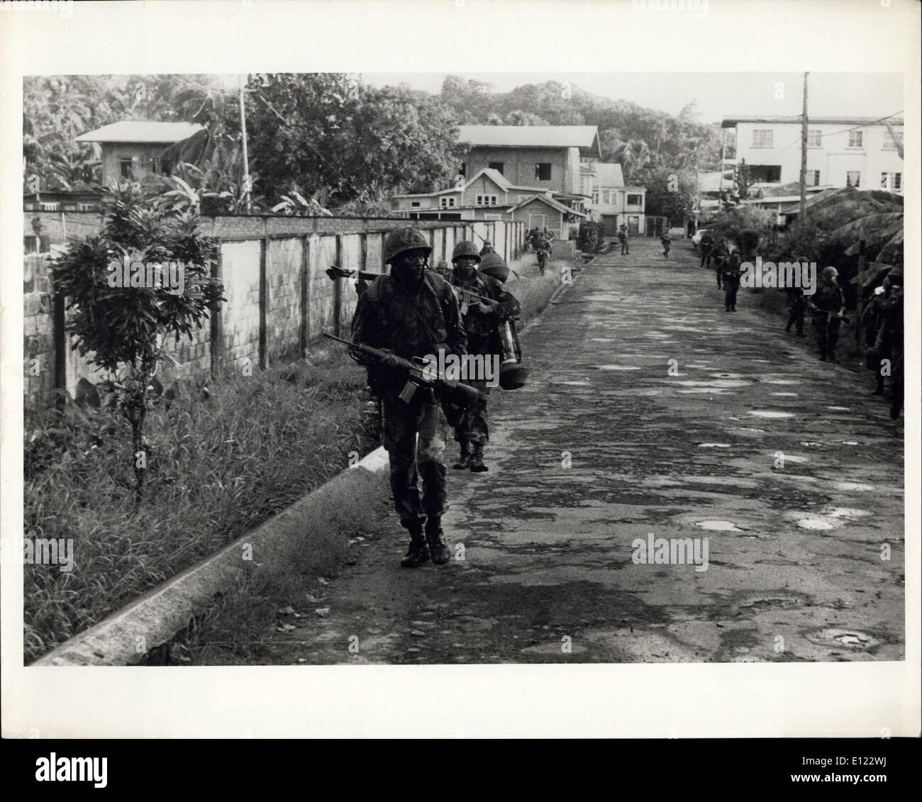 Oct. 28, 1983 - US Marines moving out of landing zone and occupying the town of Greenville. Marines cautiosly secure each street. Department of Defense photo from Consolidated News Pictures. Stock Photo