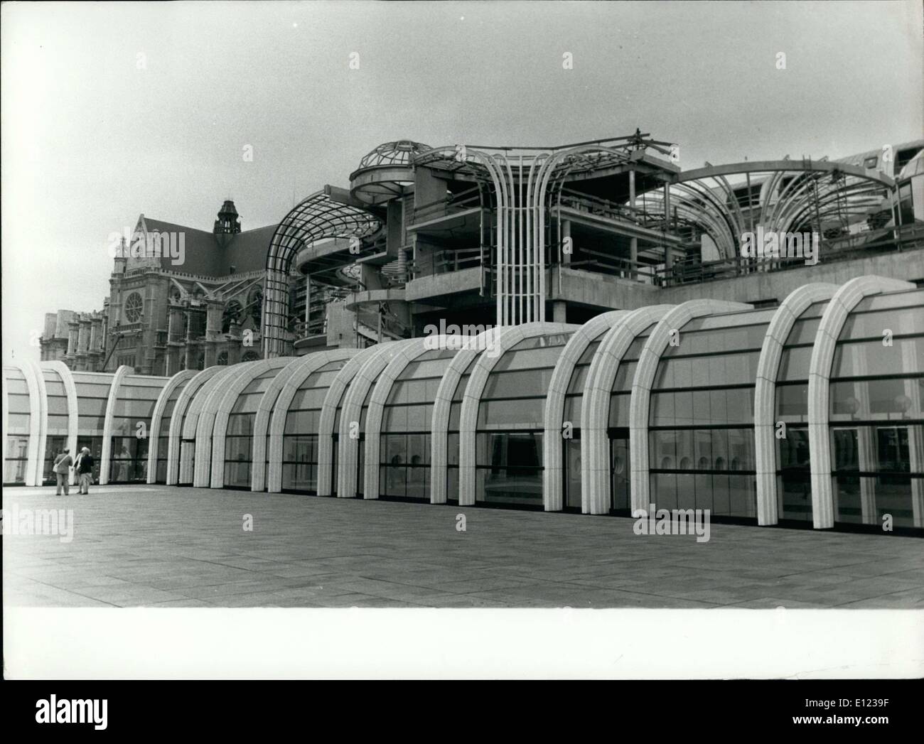 Aug. 18, 1982 - This huge set of buildings in the form of chanterelles, glass roofs, barrel vaults, and large glass and steel umbrellas will soon see the completion of its last building, Rue Lescot. The hole of Les Halles will be completely finished in 1984. Next to La Fontaine des Innocents, behind the scaffolding, about a hundred housing accommodations, a hotel, and offices are being built. The new Lescot building will be able to hold public and cultural facilities. View of the Les Halles forum interior, behind the housing accommodations in construction. Stock Photo