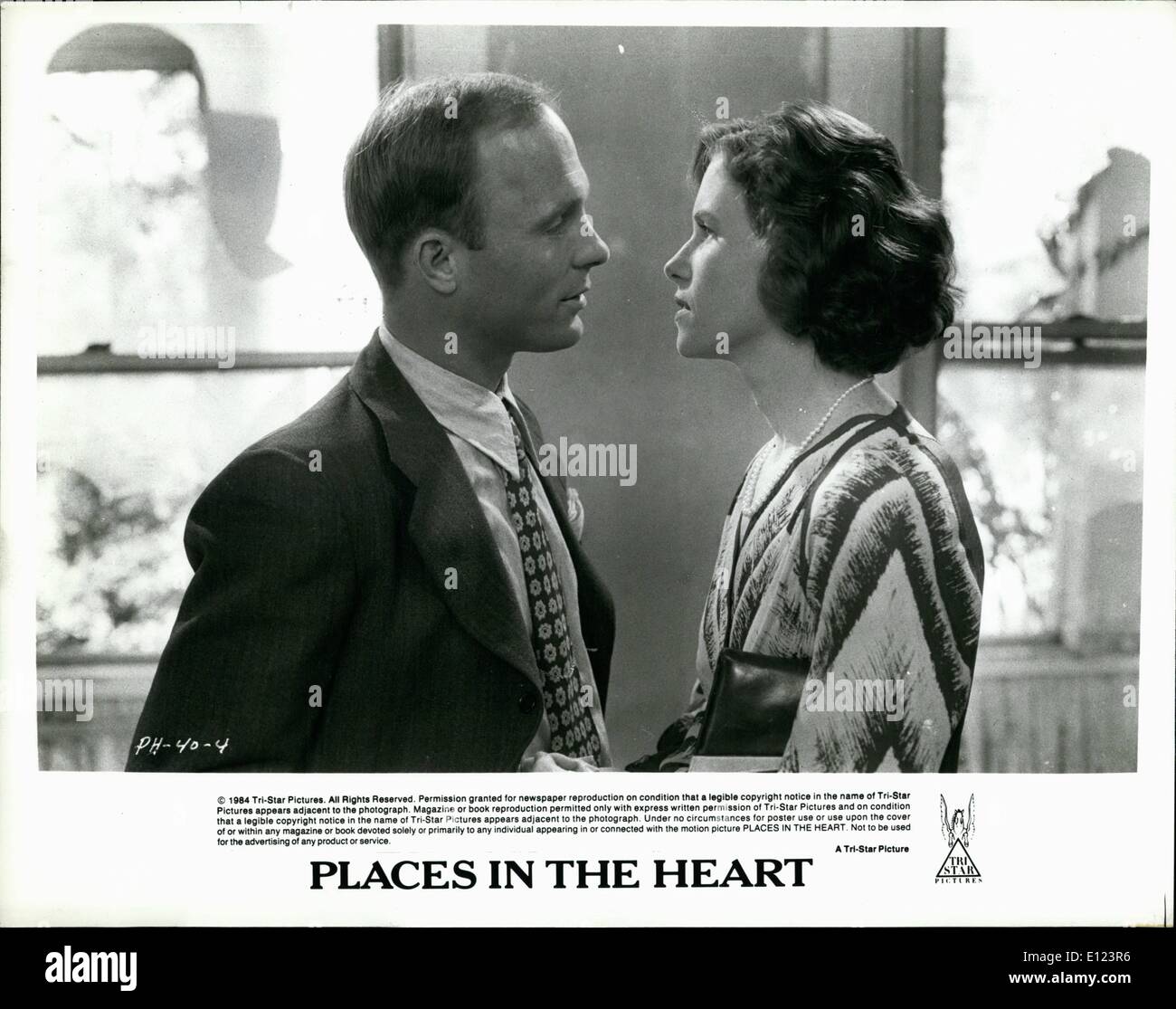 Jun. 06, 1984 - PH 40-4: Ed Harris and Amy Madigan have an extra marital affair that threatens to break up their lives with their spouses in a small Texas town during the 1930s in PLACES IN THE HEART. Written and directed by Robert Benton, PLACES IN THE HEART starring Sally Field, is a Tri-Star release. Stock Photo