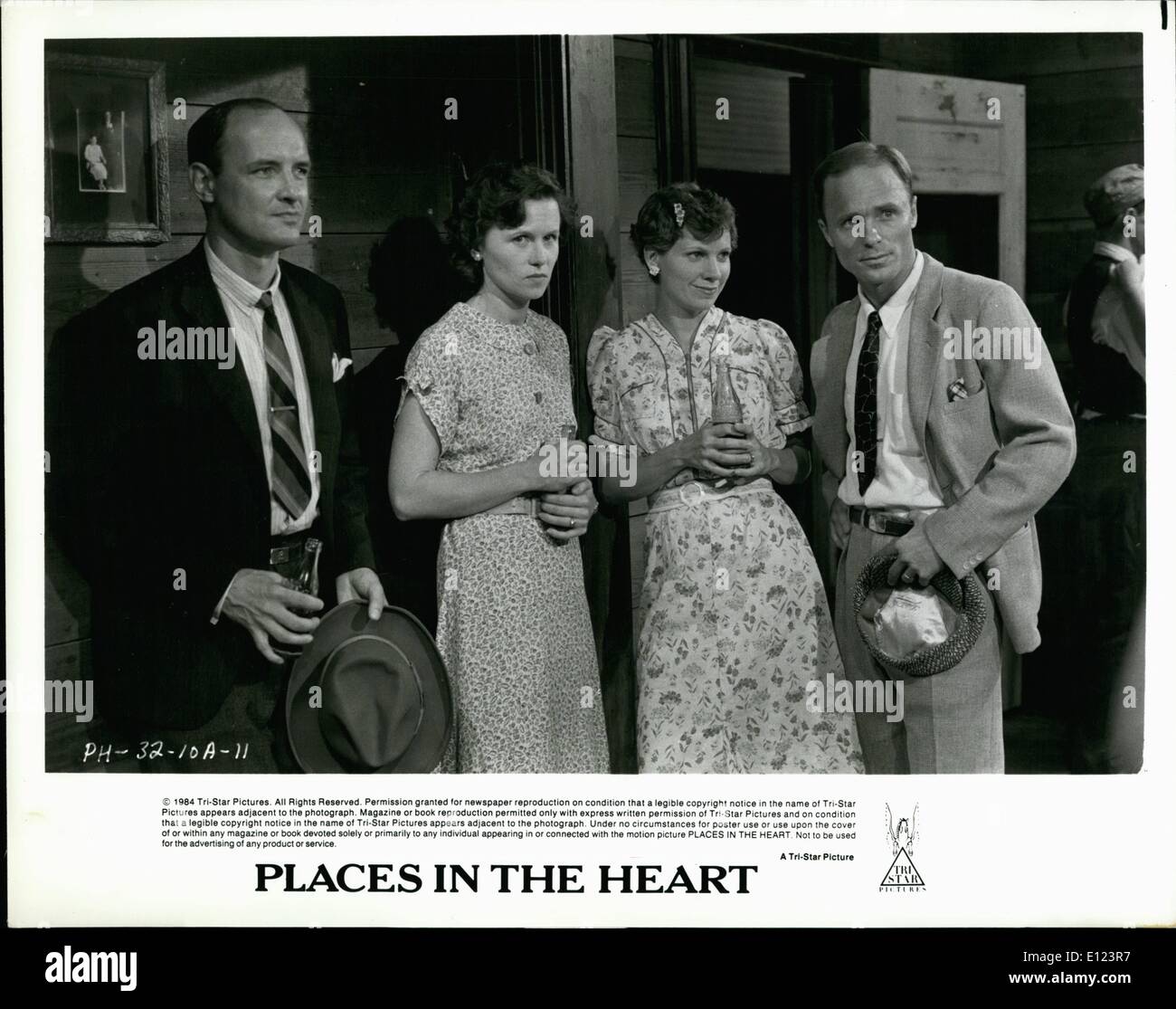 Jun. 06, 1984 - From left to right: Terry O'Quinn and Amy Madigan and Lindsay Crouse and Ed Harris play two couples from the small Texas town of Waxahachie whose lives become emotionally intertwined in PLACES IN THE HEART. Written and directed by Robert Benton, PLACES IN THE HEART is a Tri-Star release. Stock Photo