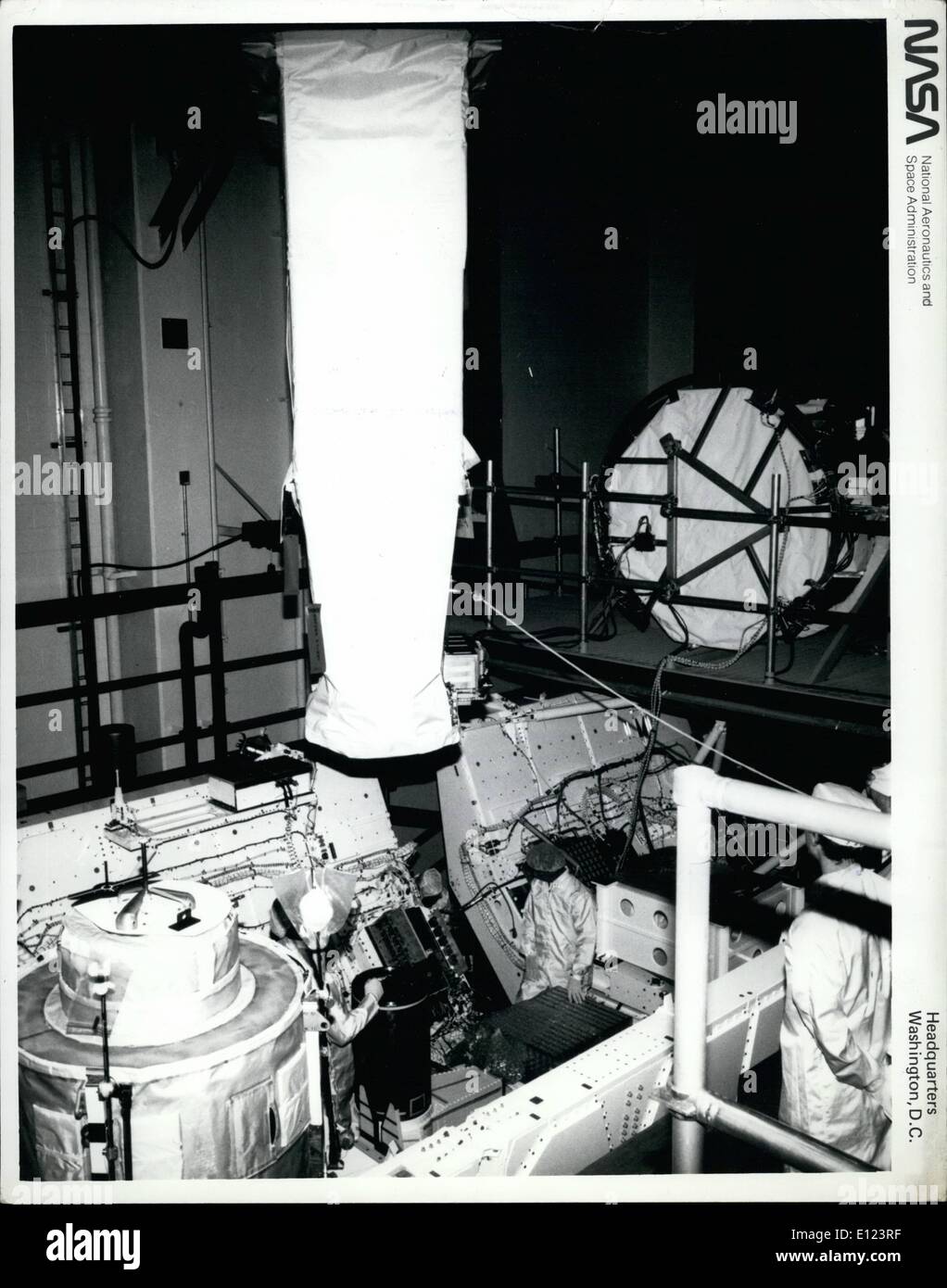 Jun. 06, 1984 - Kennedy Space Center, Fla.,--Technicians install the last major experiment called the ''Hard X-Ray Imaging of Clusters of Galaxies and Other Extended X-Ray Sources,'' on a Space lab 2 pallet in the Operations and Checkout train and will mark the first flight of the Igloo and Instrument Pointing System. The experiment, which consists of two identical X-ray telescopes will record images and spectra of extended X-ray sources which will be used to identify the sources and omission mechanisms Stock Photo