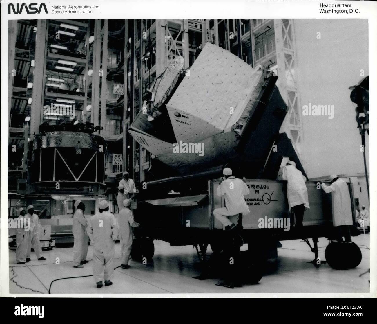 Jul. 07, 1984 - KENNEDY SPACE CENTER. Fla.--Its antenna array barely visible sticking out of the sunshield cradle, the TELSTAR 3/Payload Assist Module arrive at the Vertical Processing Facility for installation in the checkout stand. TELSTAR 3 is oce of three commercial satellites that the orbiter Discovery All deploy into orbit on the 41-0 mission scheduled for late August. To the left of TELSTAR, already installed in the test cell, is LEASAT-2, a Hughes-built communications spacecraft that will be leased to the U.S Stock Photo