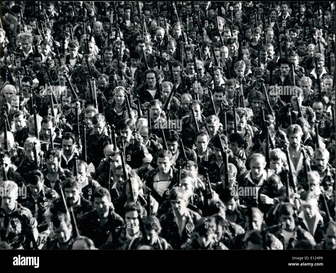 Oct. 10, 1990 - ''Waffenlauf'', a Swiss military Race.: Some of 976 participants of the ''35 Krienser Waffenlauf'' are just after the start of the military race over 19,1 kilometers in Kriens near Lucerne (Switzerland), Oct.28. This race was the 9th of 11 races of the Swiss Military Race Championship where the participants run in the uniform of the Swiss army equipped with rucksack and army rifles. Stock Photo