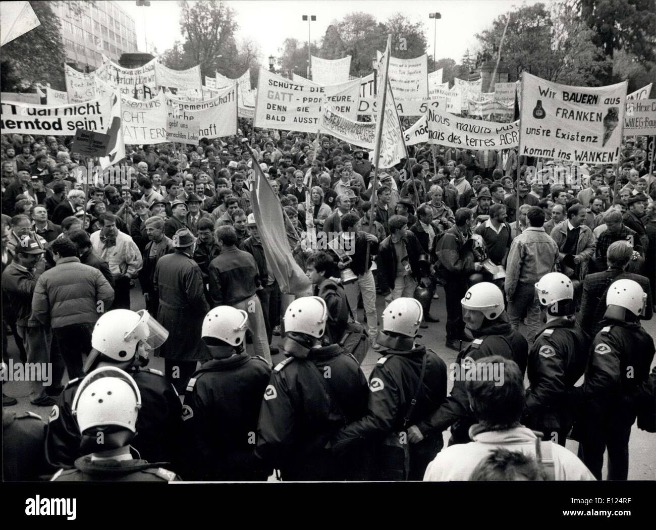 Nov. 16, 1990 - Formers Demonstration In Geneva: Thousands of Swiss, German and French farmers assembled on November 13th in Geneva to demonstrate against the present and future GATT-Policy that obviously will be the ruin of many a small-and middle scale farmer in Central Europe. Picture shows the United farmers next to armed policemen who obviously are s;lightly scared. Stock Photo