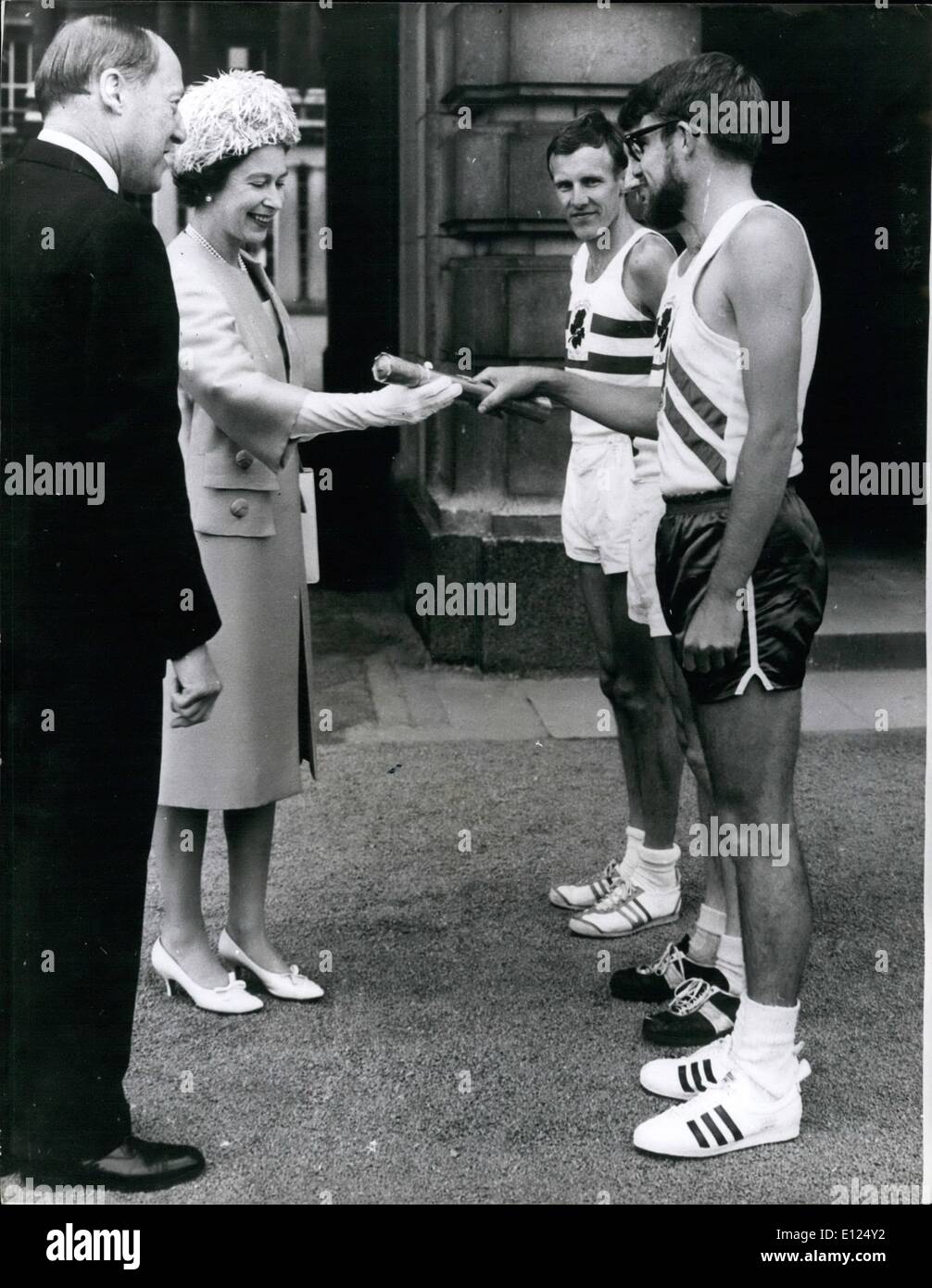 Jul. 07, 1986 - The Queen commonwealth games message leaves: At a ceremony in the forecourt of Buckingham Palace, London, this morning, H.M. The Queen handed her special message, contained in a baton, to three athletes who were carrying it on the first stage of a relay that will culminate in Jamaica, where the 8th British Empire and Commonwealth Games are being held. The relay will carry the message to London Airport from where it will be flown by BOAC aircraft to the West Indies. Photo shows H.M Stock Photo