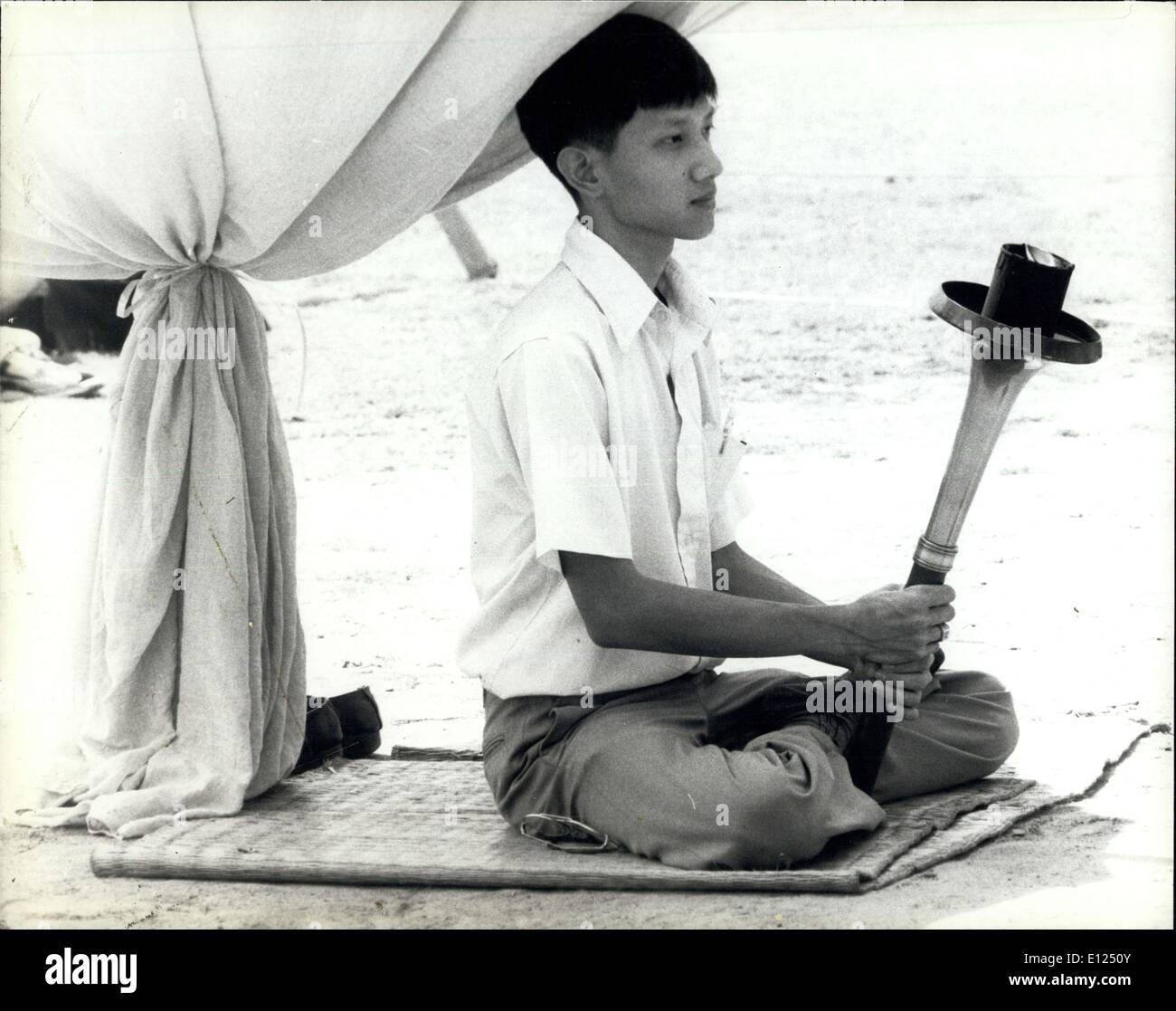 Nov. 12, 1986 - Thailand: Young Thai with the torch of peace during First Earth Run celebrations in Bangkok. The First Earth Run torch relay left New York on September 16 on an 86-day round the journey marking the International year of Peace and the 40th Anniversary of UNICEF. Credit: UNICEF Stock Photo