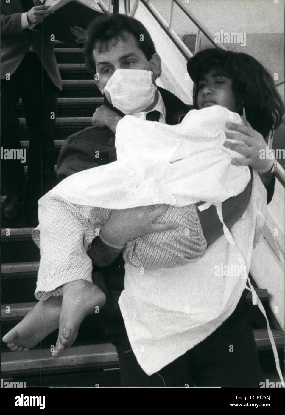 Mar. 03, 1988 - Poison Gas Victims arrive in Switzerland Vitim's of the poison gas attack on Iranian territory last week are carried out of an airplane, march 29, after they arrived on Geneva airport for medical treatment ion Swiss hospitals. Stock Photo