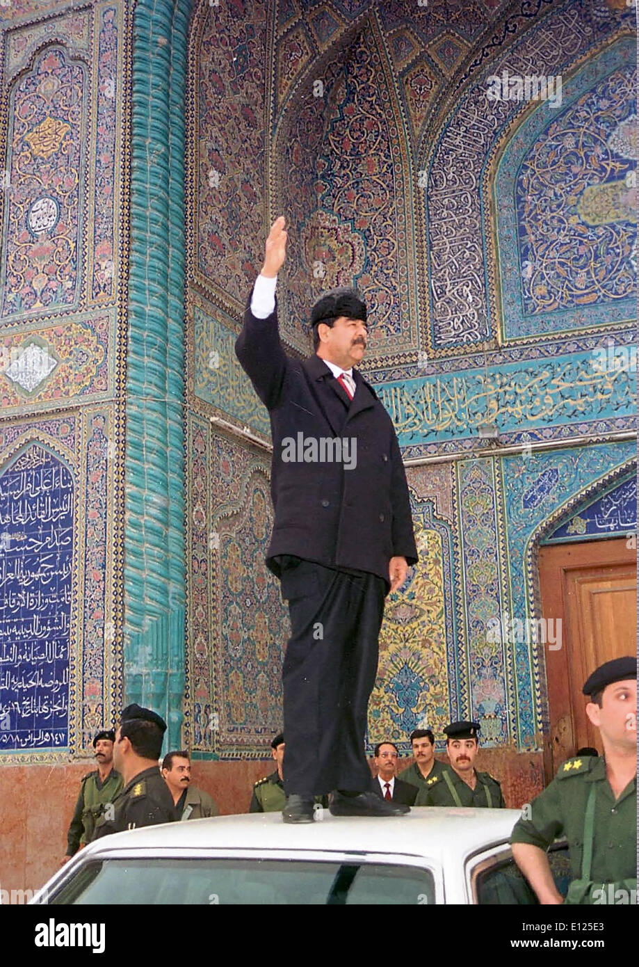 Iraqi Dictator Saddam Hussein stands on car in front of Holy Shrine Imam Ali, Najaf, Mar. 25, 1998 Stock Photo