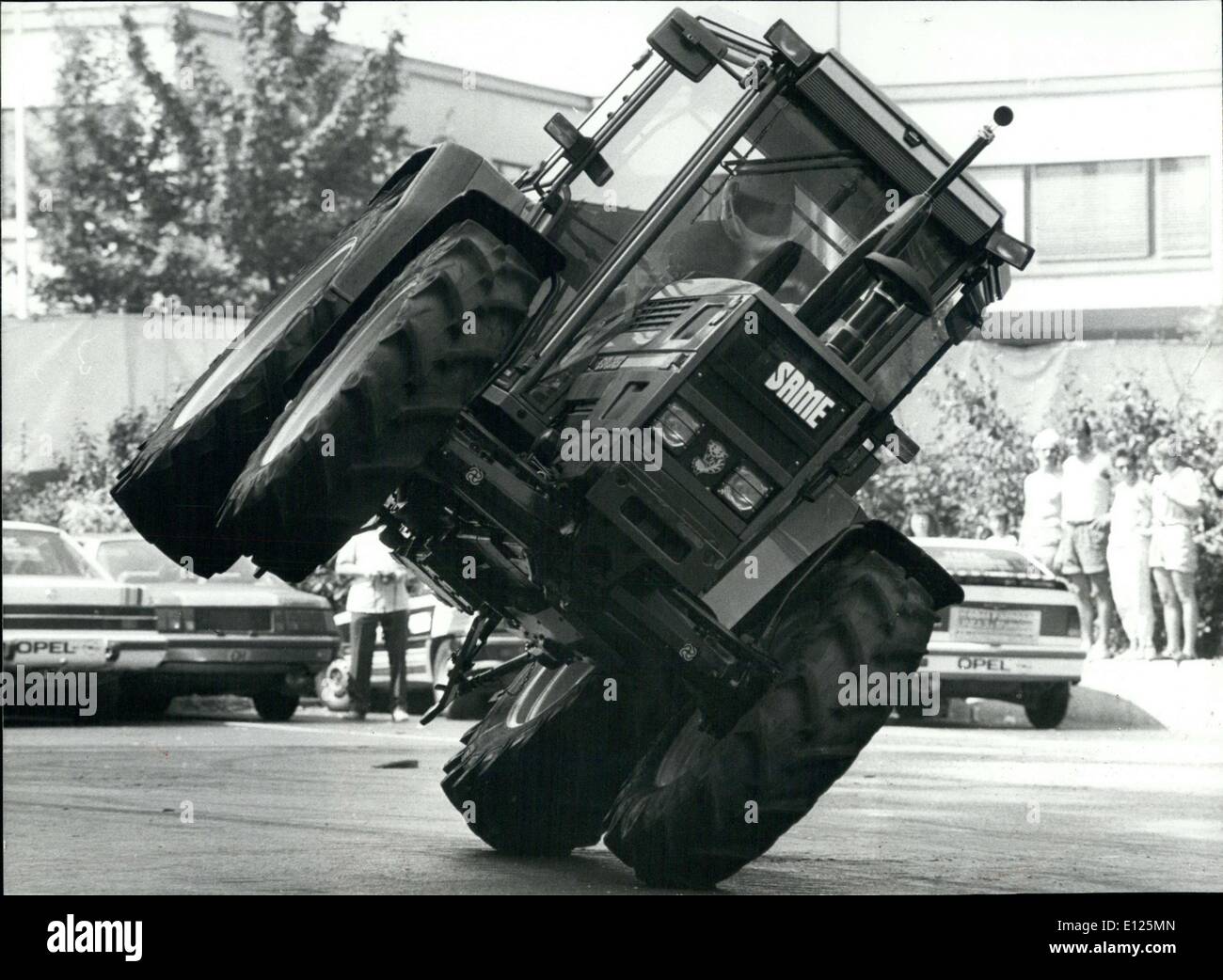 Aug. 23, 1988 - Extravagant Tractor-driving-style: On Sunday August 14th a monster-truck show has been produced in Zurich(Switzerland). Photo shows One of the artists of the show driving a tractor in an extravagant style-which is not considered to be imitated by every-days drivers like you and me. Stock Photo