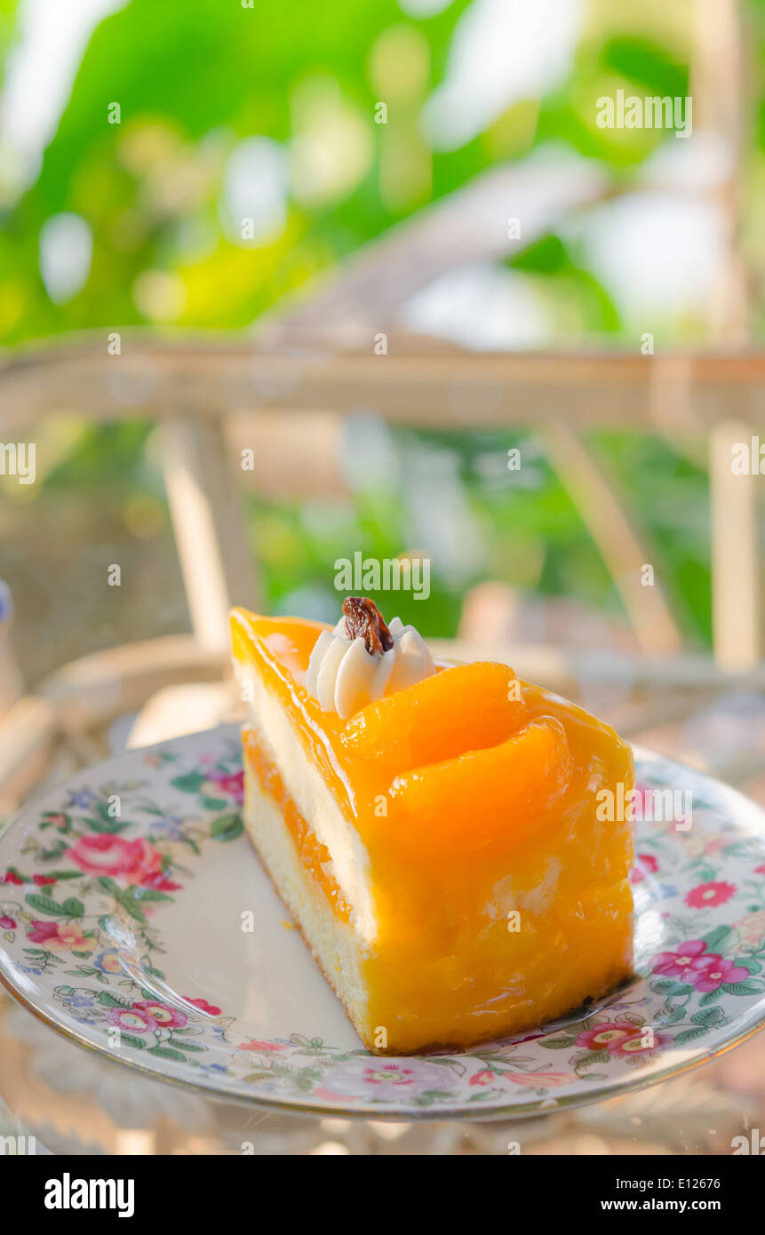 piece of fresh orange cake on dish Stock Photo