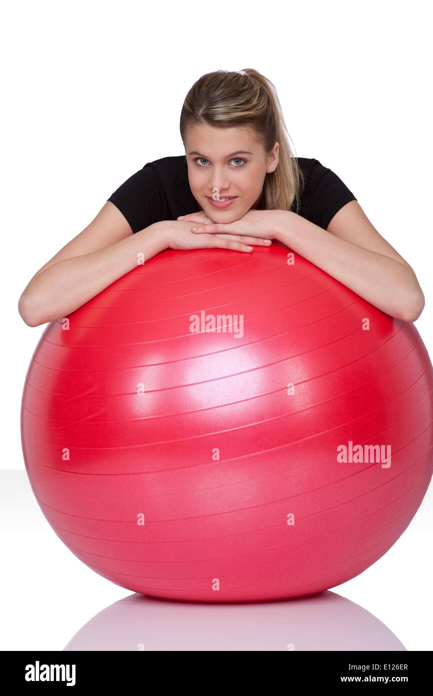 Feb. 07, 2009 - Feb. 7, 2009 - Fitness - Young happy woman with exercise ball on white background Stock Photo