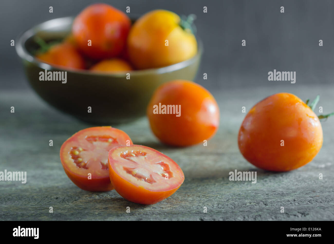 red ripe vegetable , tomato over wooden table Stock Photo