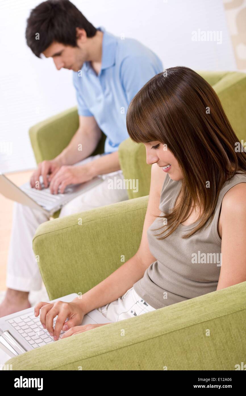 Apr. 17, 2010 - April 17, 2010 - Student - two teenager with laptop in living room, on green armchair Ã‚Â© CTK/ZU Stock Photo