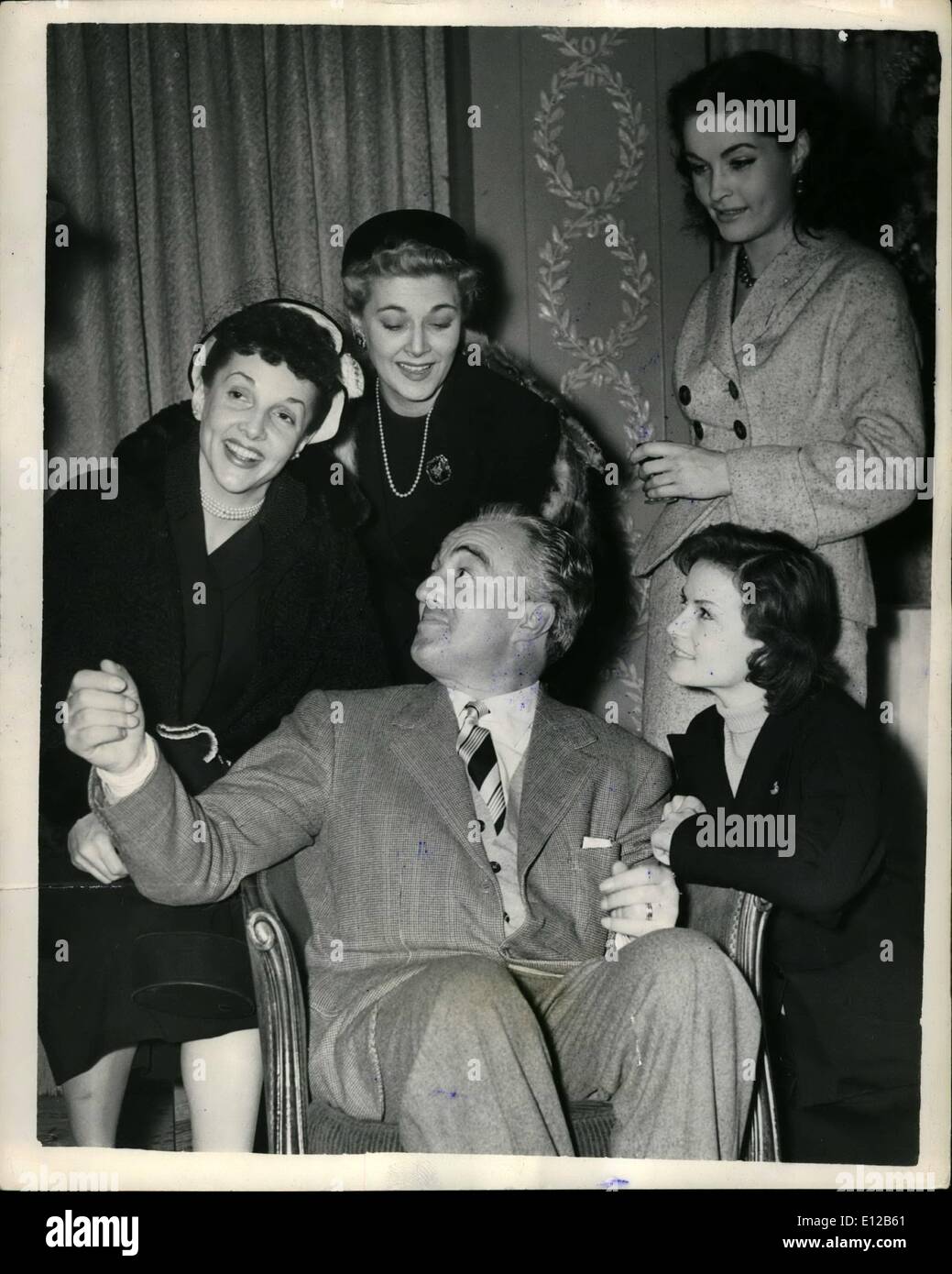 Dec. 09, 2011 - Italian film actor and director in London. Vittorio De Sica, the Italian film actor and director, he directed Mirsole in Milan arrived in London today. Keystone Photo Shows: Vittorio De Sica, seen with (L to R): Billie Worth, Hy Hazell, Mary Germaine and Eva Bartok (kneeling), at today's press reception. Stock Photo