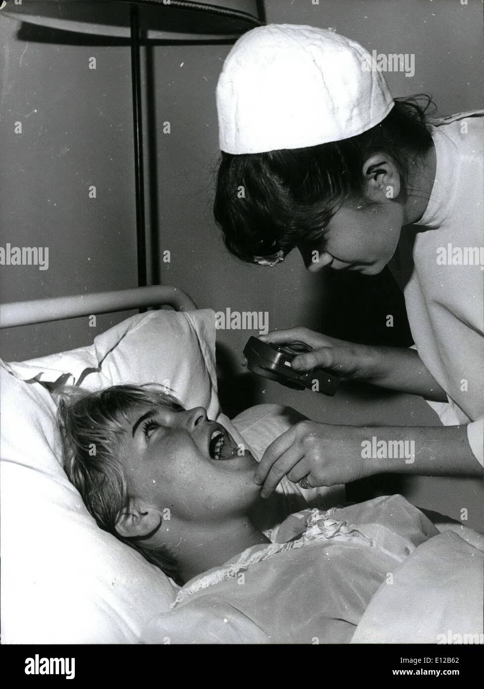 Dec. 09, 2011 - Minou Drouet wants to be a nurse. Minou Drouet who achived fame as a child poet (she started writing poems when she was 8) is now training as a hospital nurse. OPS: Minou Drouet pictured with patients in a hospital near Paris. Oct. 13/65 Stock Photo