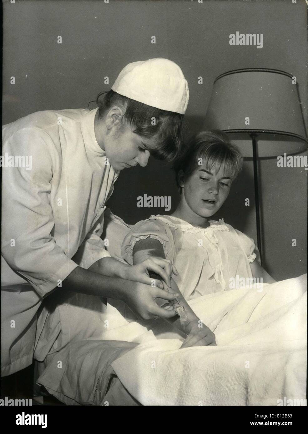 Dec. 09, 2011 - Minou Drouet wants to be a nurse. Minour Drouet who achieved fame as a child poet (she started writing poem when she was 8) is now training as a hospital nurse. OPS: Minou Drouet pictured with patients in a hospital near Paris. Oct. 13/65 Stock Photo
